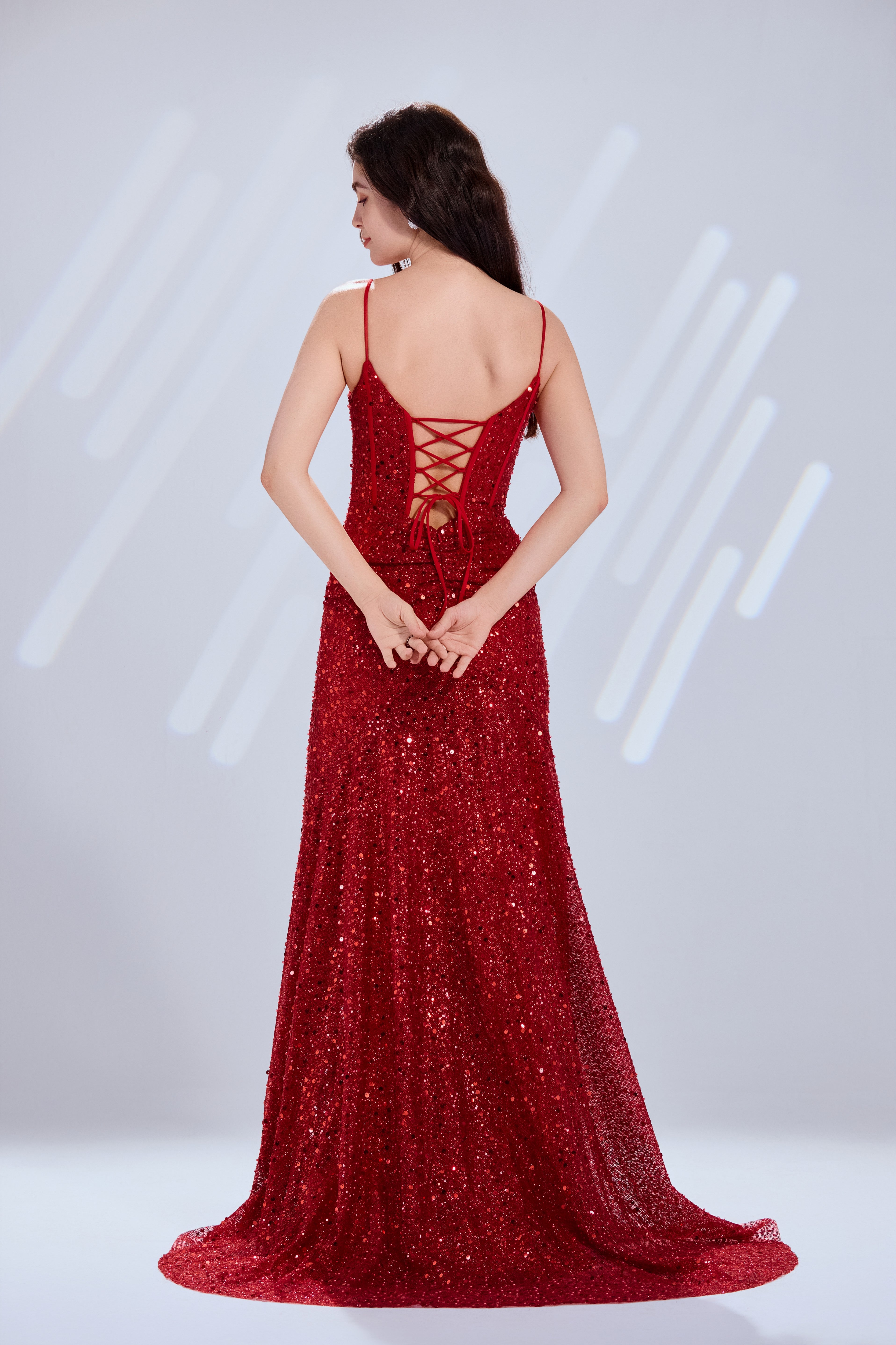 Red sequin mermaid prom dress with open crisscross back and long flared train