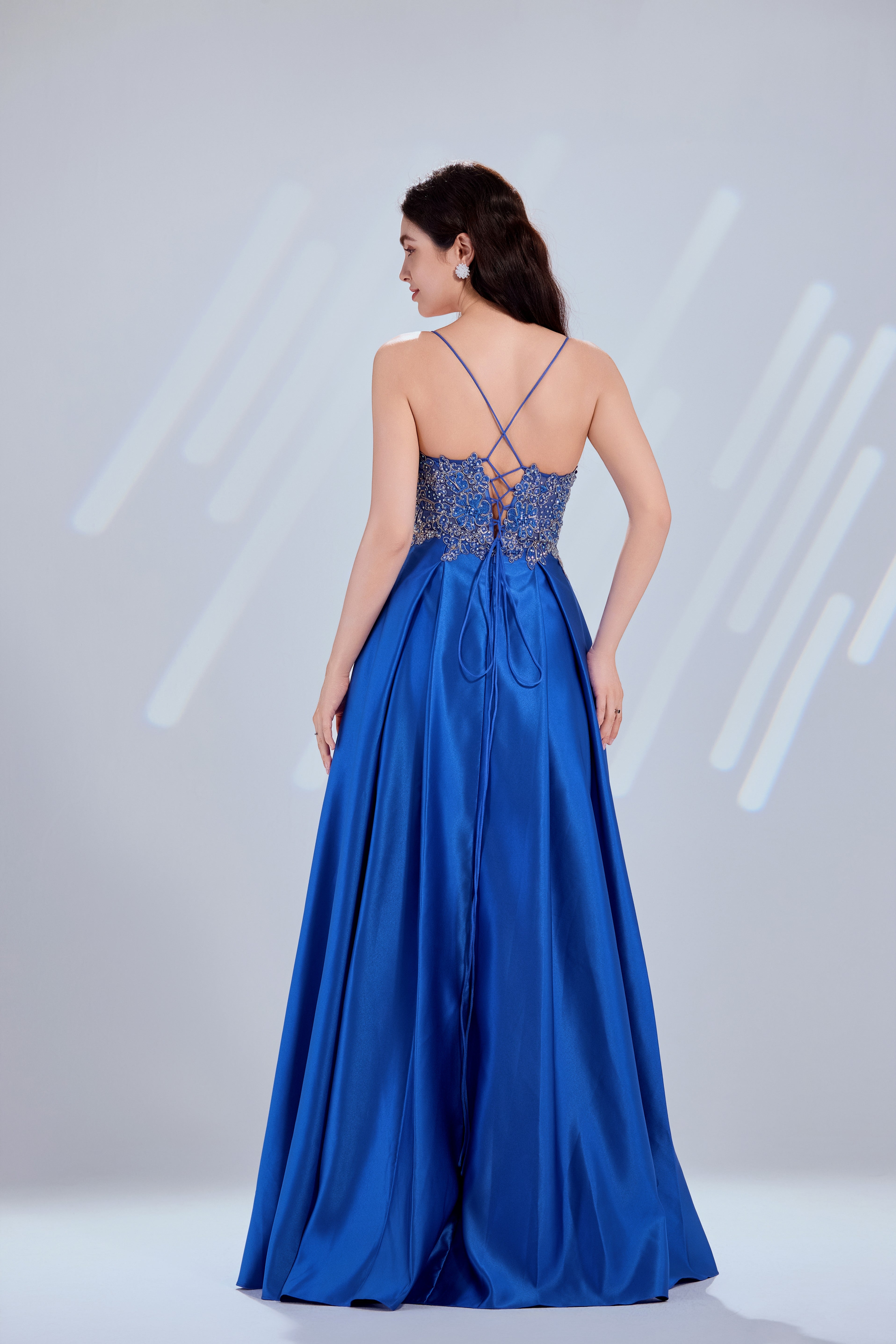 Blue satin A-line prom dress with crisscross laced back and beaded bodice