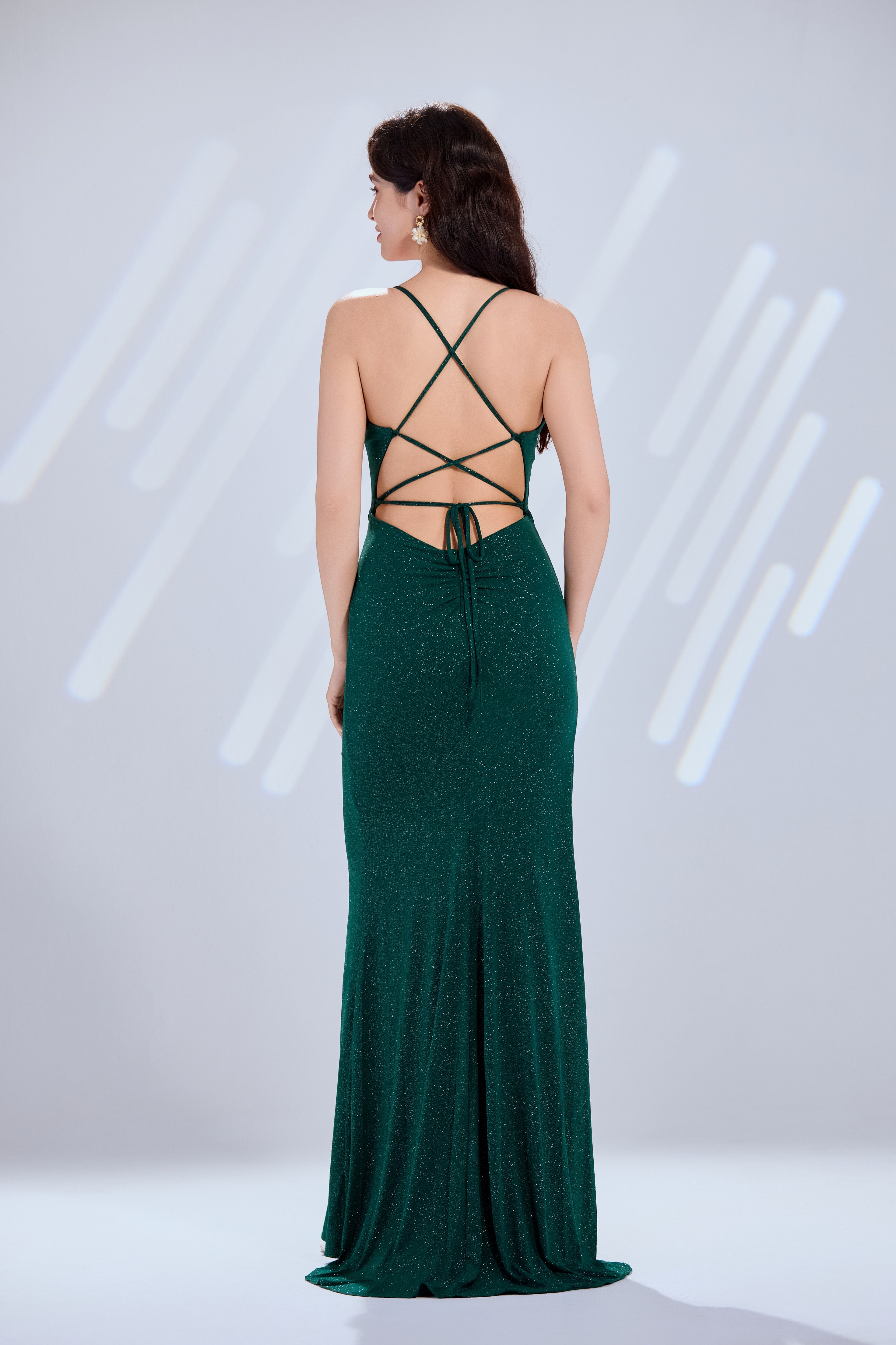 Shimmering glitter knit mermaid prom dress with lace-up crisscross open back.