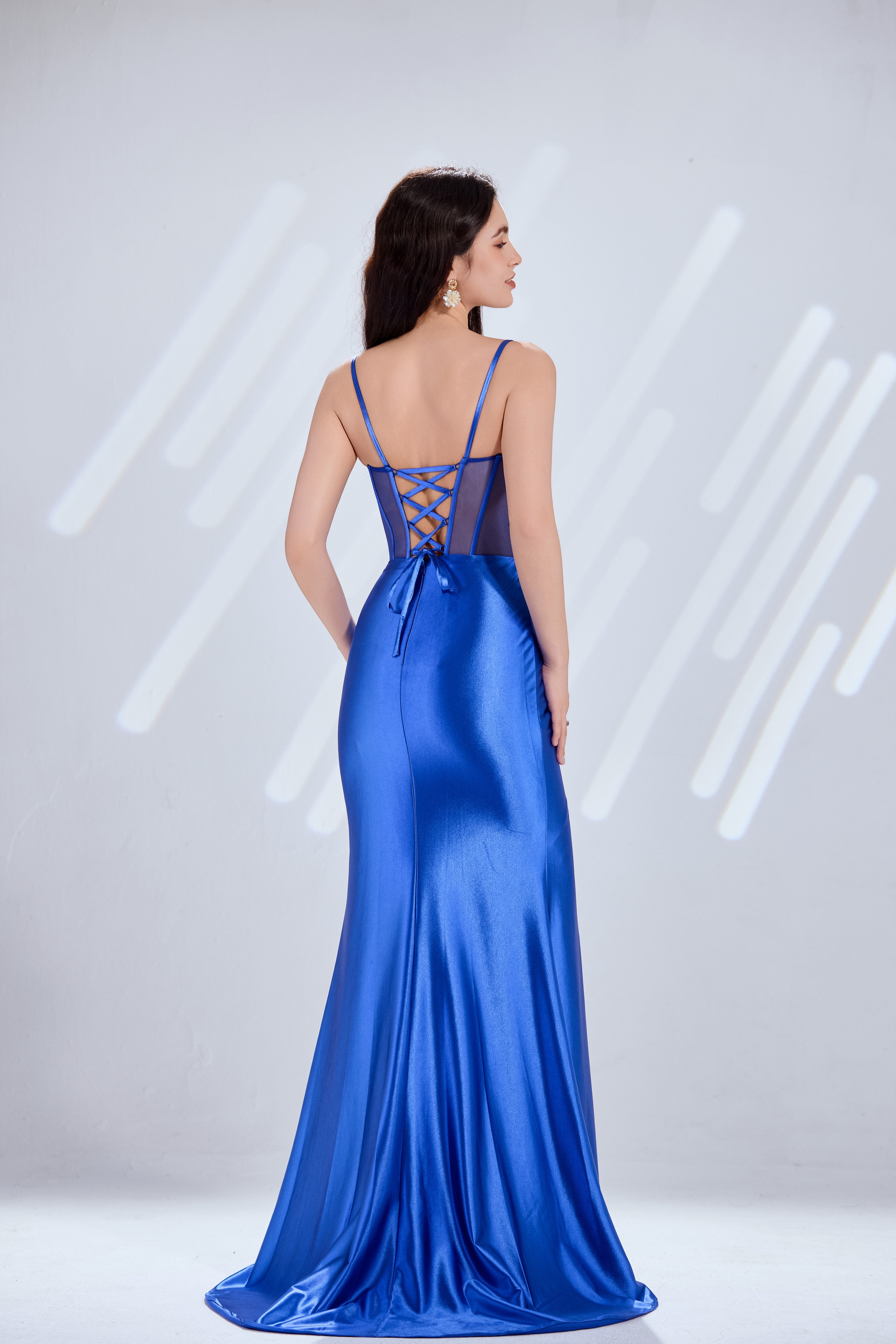 Royal blue satin mermaid prom dress with sheer mesh back panel and crisscross lacing