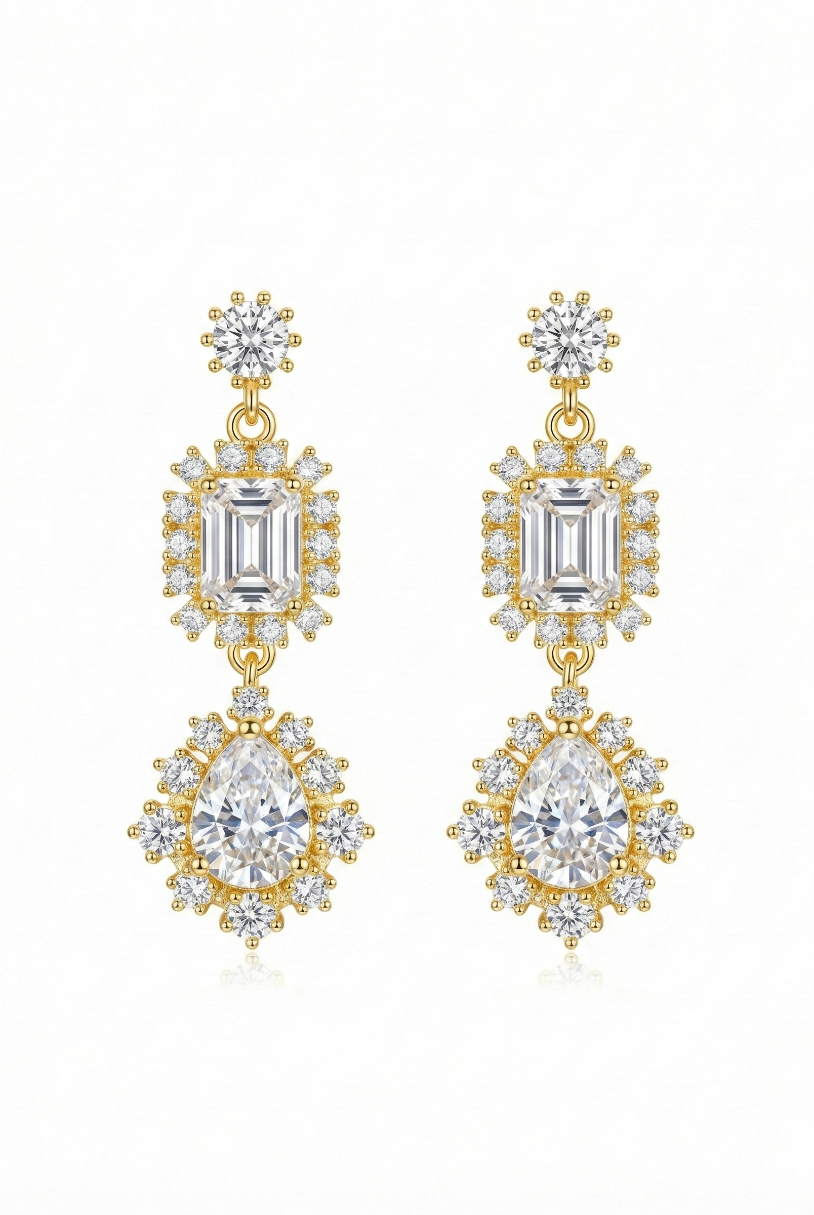 Gold-tone chandelier earrings with emerald-cut and pear-drop clear stones