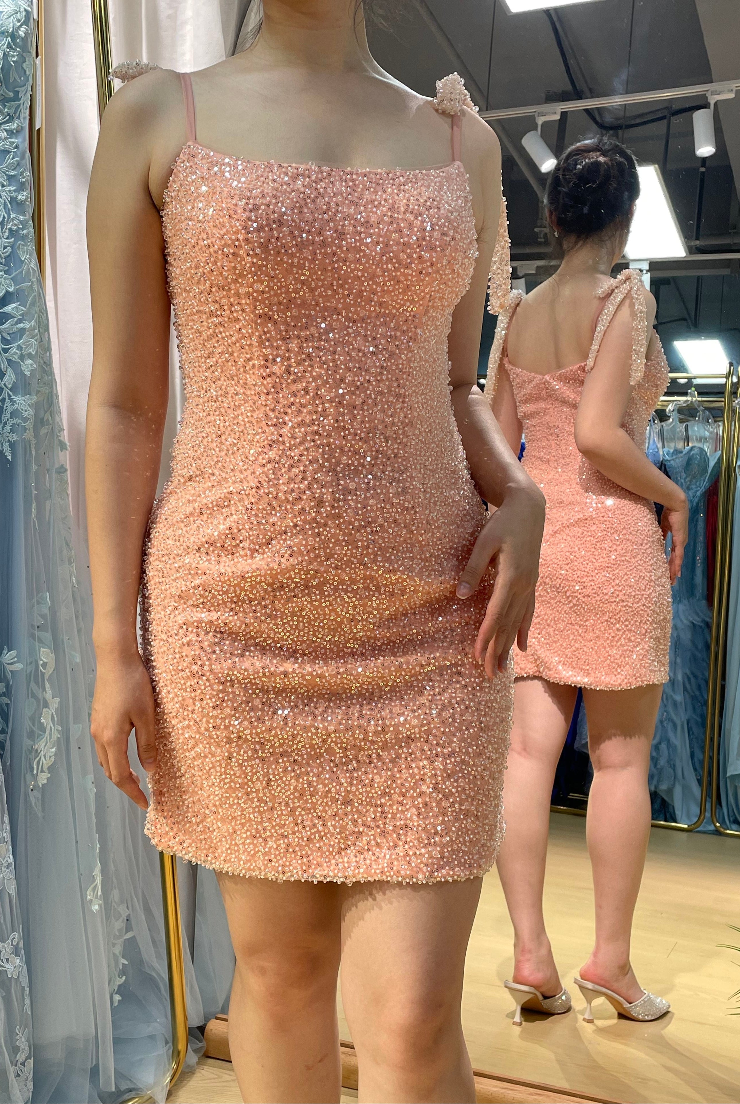 Pink sequin mini dress with square neckline, beaded bodice, and tie straps