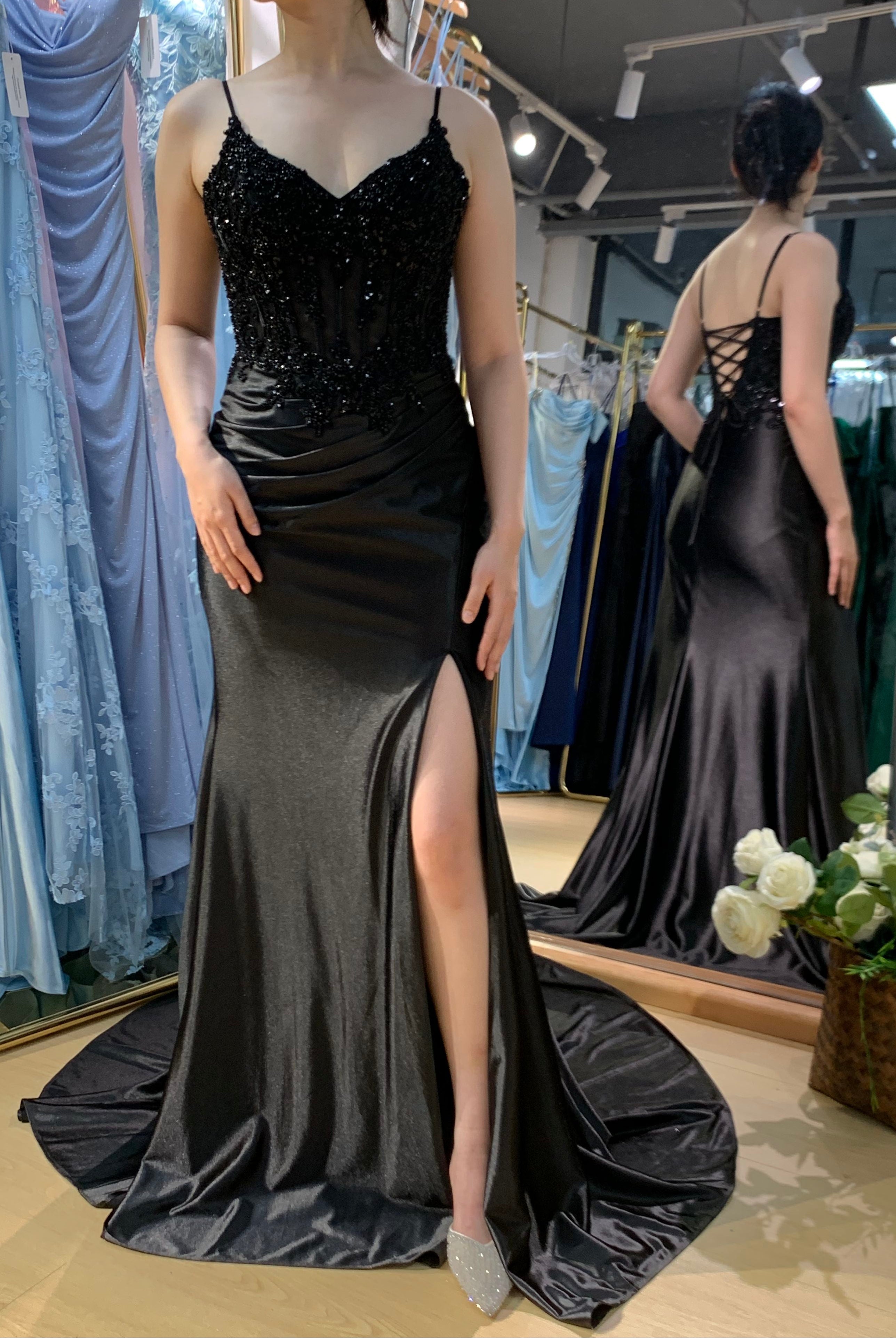 Black corset-style prom dress with beaded straps and high-slit satin skirt