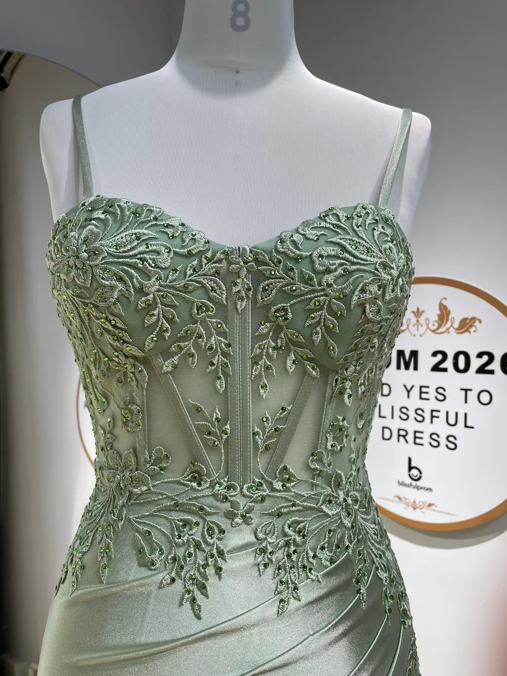FLORIA sage green corset prom dress on mannequin, sweetheart neckline, beaded bodice