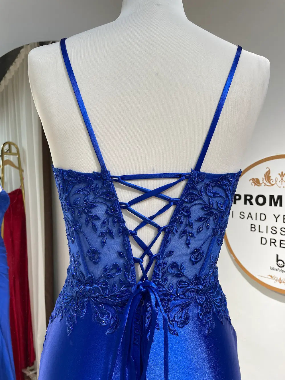 Royal blue dress bodice with sheer lace, and crisscross open-back straps