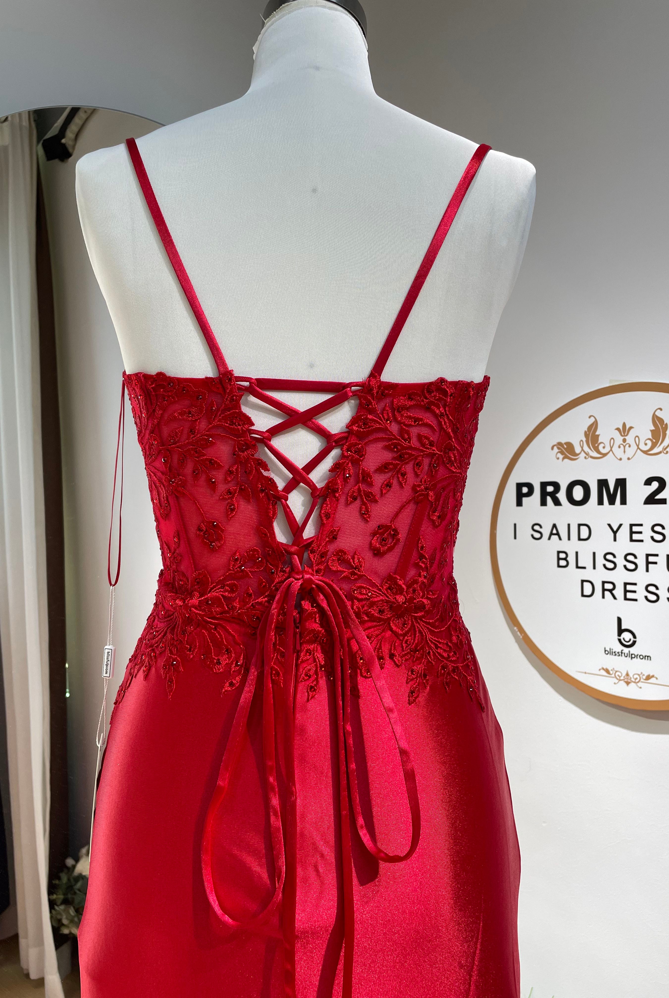 Red lace corset formal dress with crisscross open back and spaghetti straps