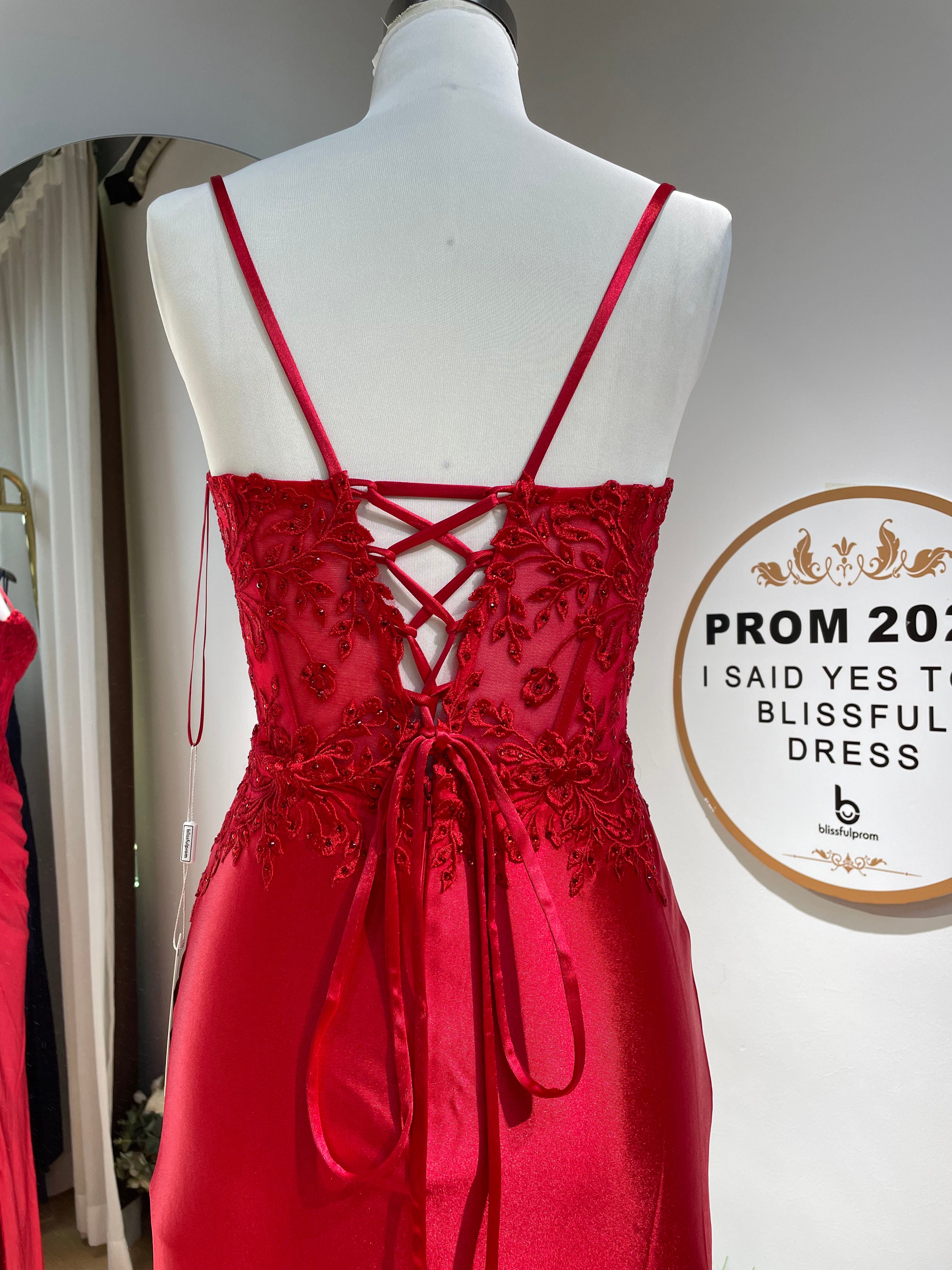 Red lace corset formal dress with crisscross open back and spaghetti straps