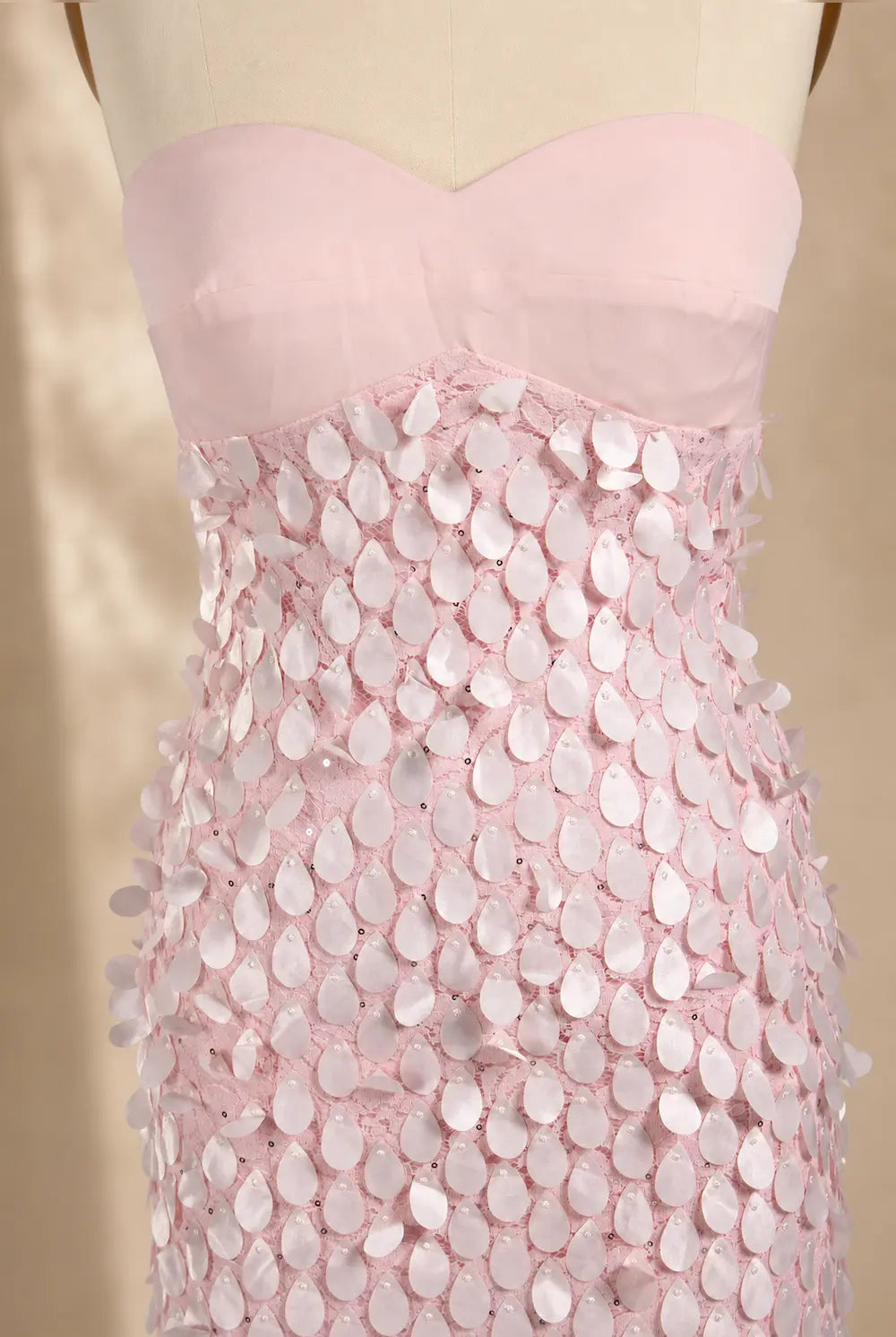 Pink textured bodice with petal sequin overlay and corset fit