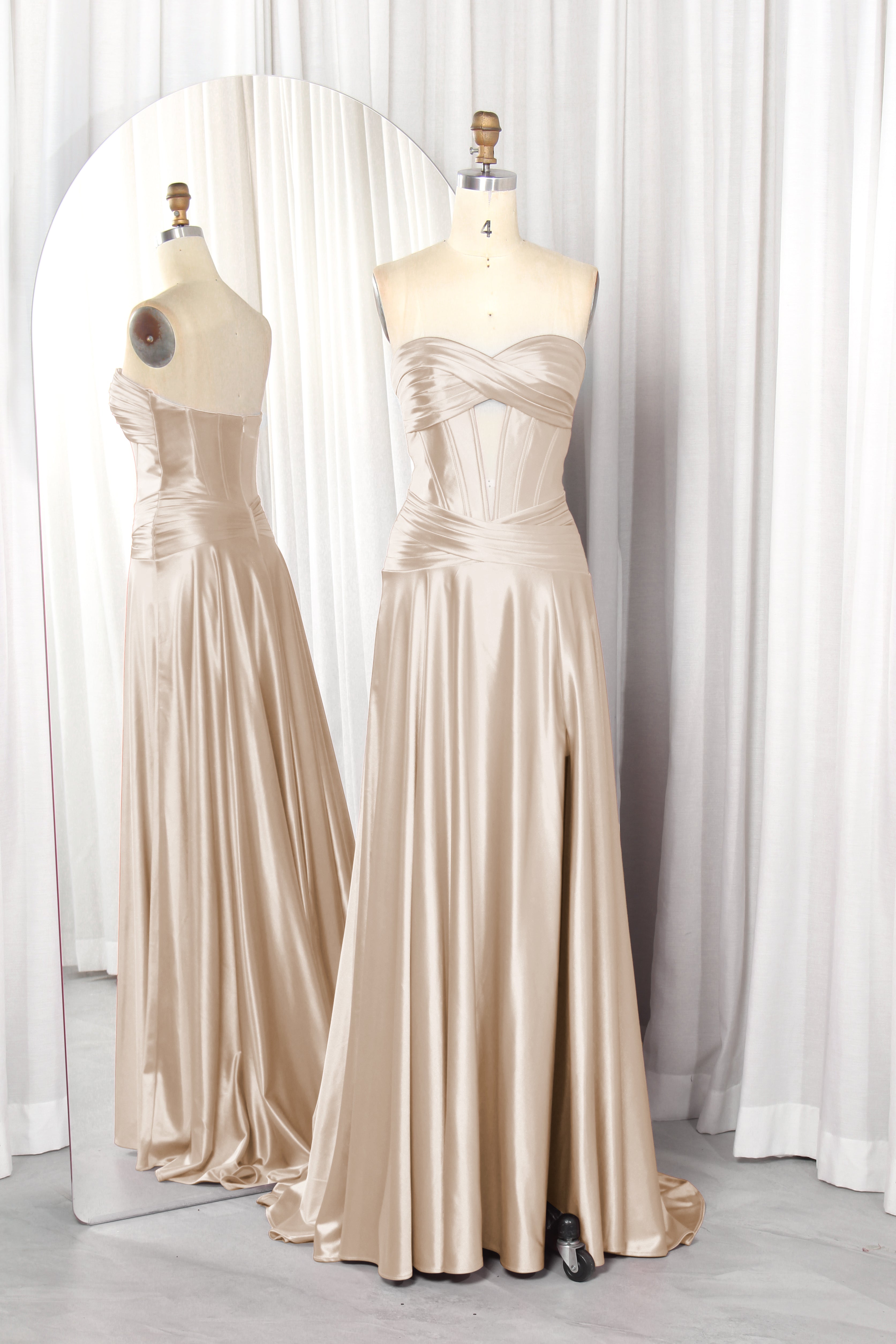 strapless satin prom dress with a front cutout and high slit.