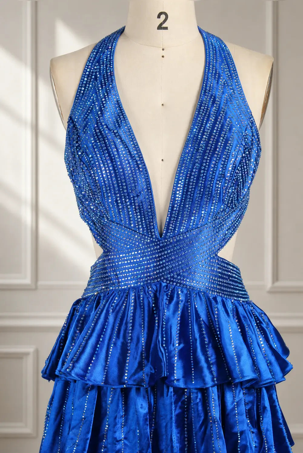 Royal blue halter maxi dress with deep V neckline and glittery tiered ruffles