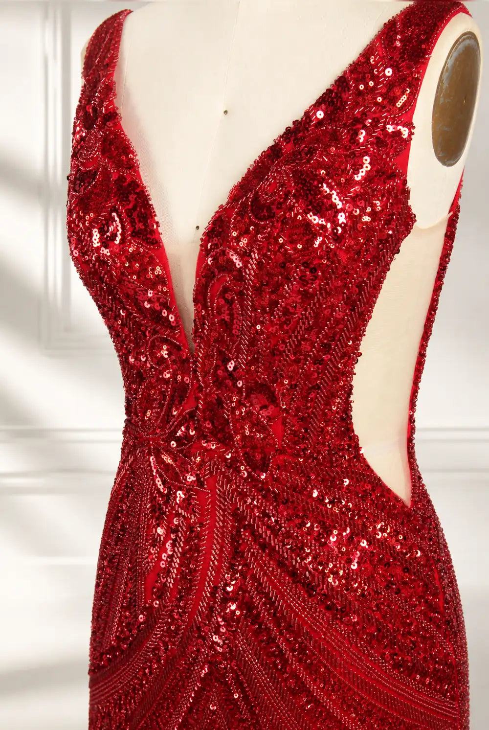 Red sequin V-neck bodice detail with open back and sparkling beadwork