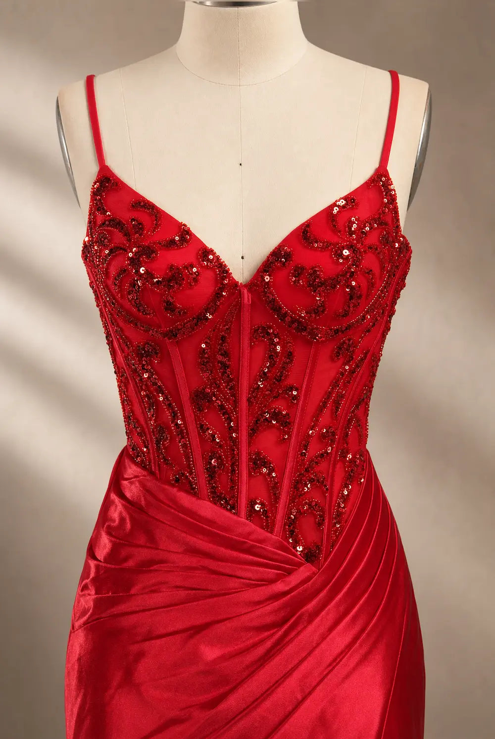 Red sequin corset gown with spaghetti straps and ruched satin skirt