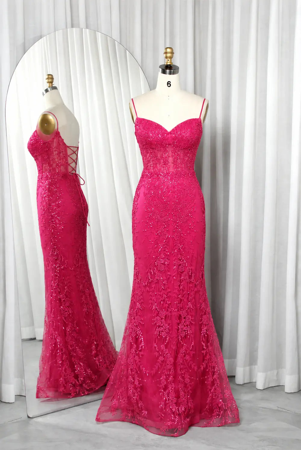 Hot pink mermaid corset prom dress with lace texture and thin straps