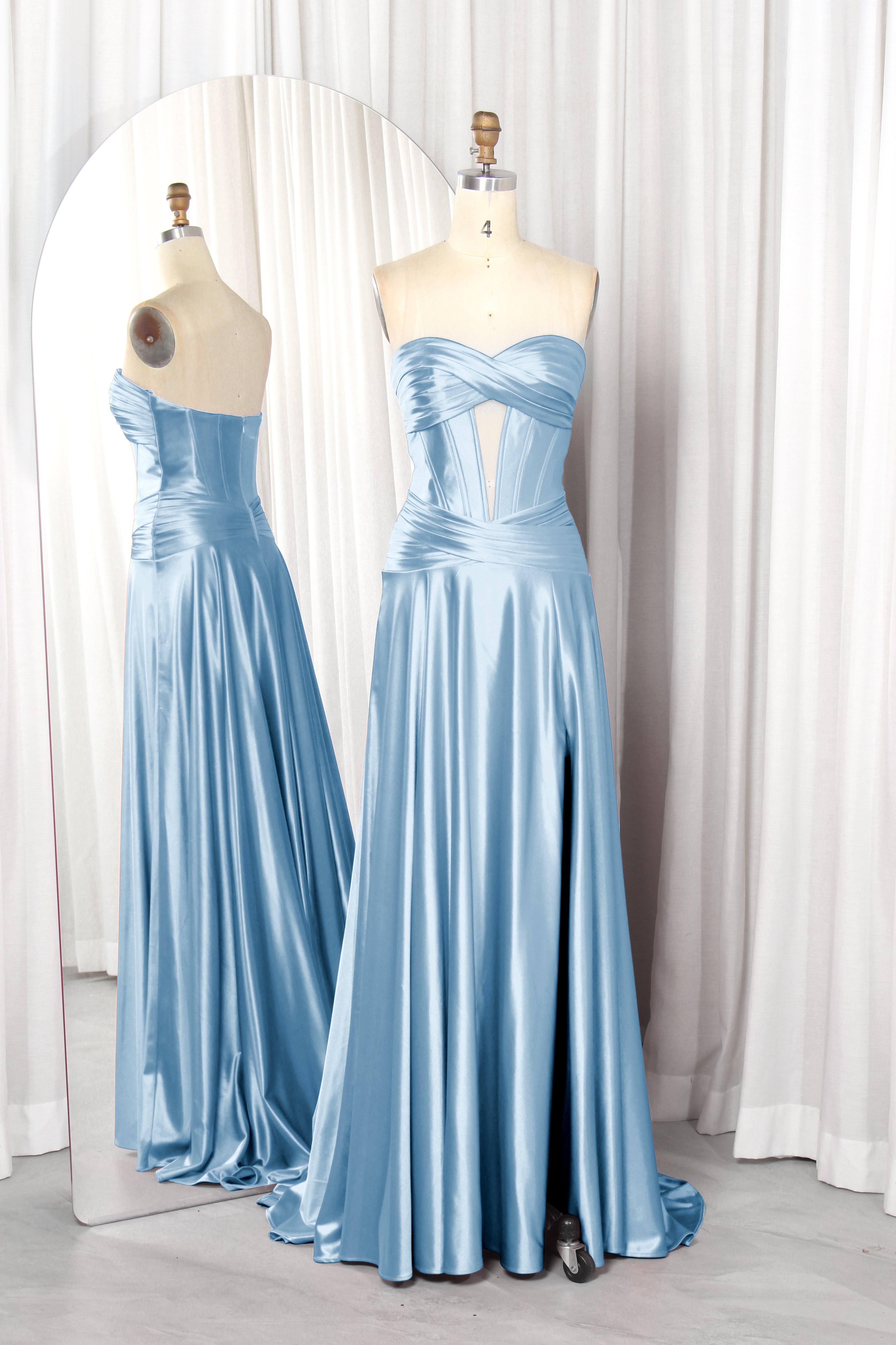 strapless satin prom dress with a front cutout and high slit.