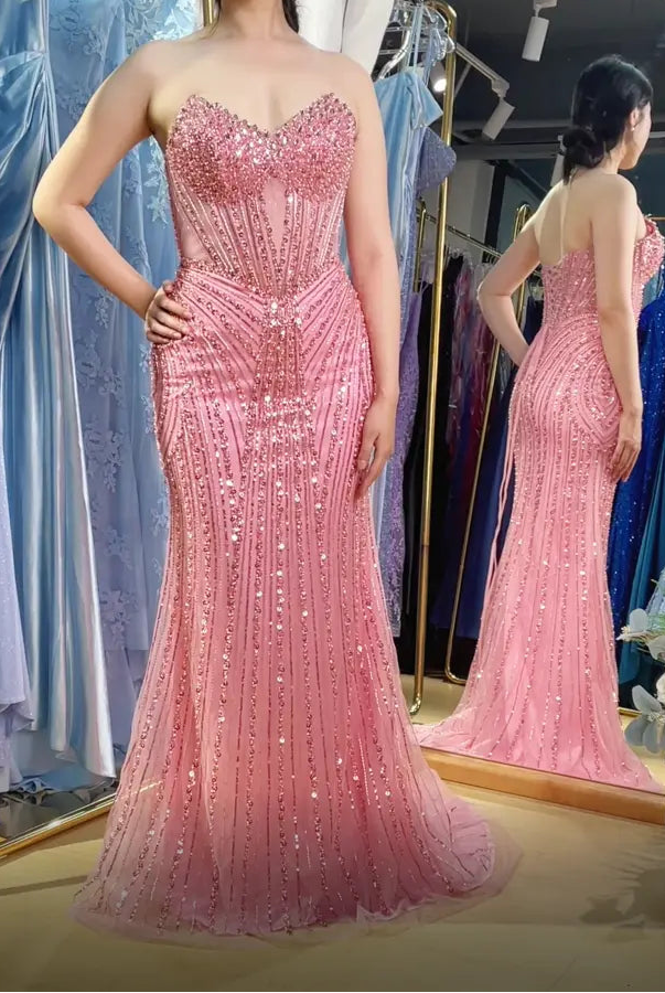 Pink beaded corset-style mermaid prom dress with sweetheart neckline and spaghetti straps