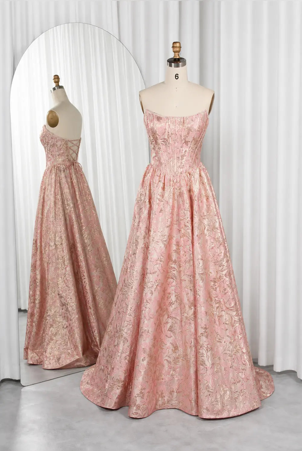 Pink floral maxi dress with square neckline, thin straps, and full skirt