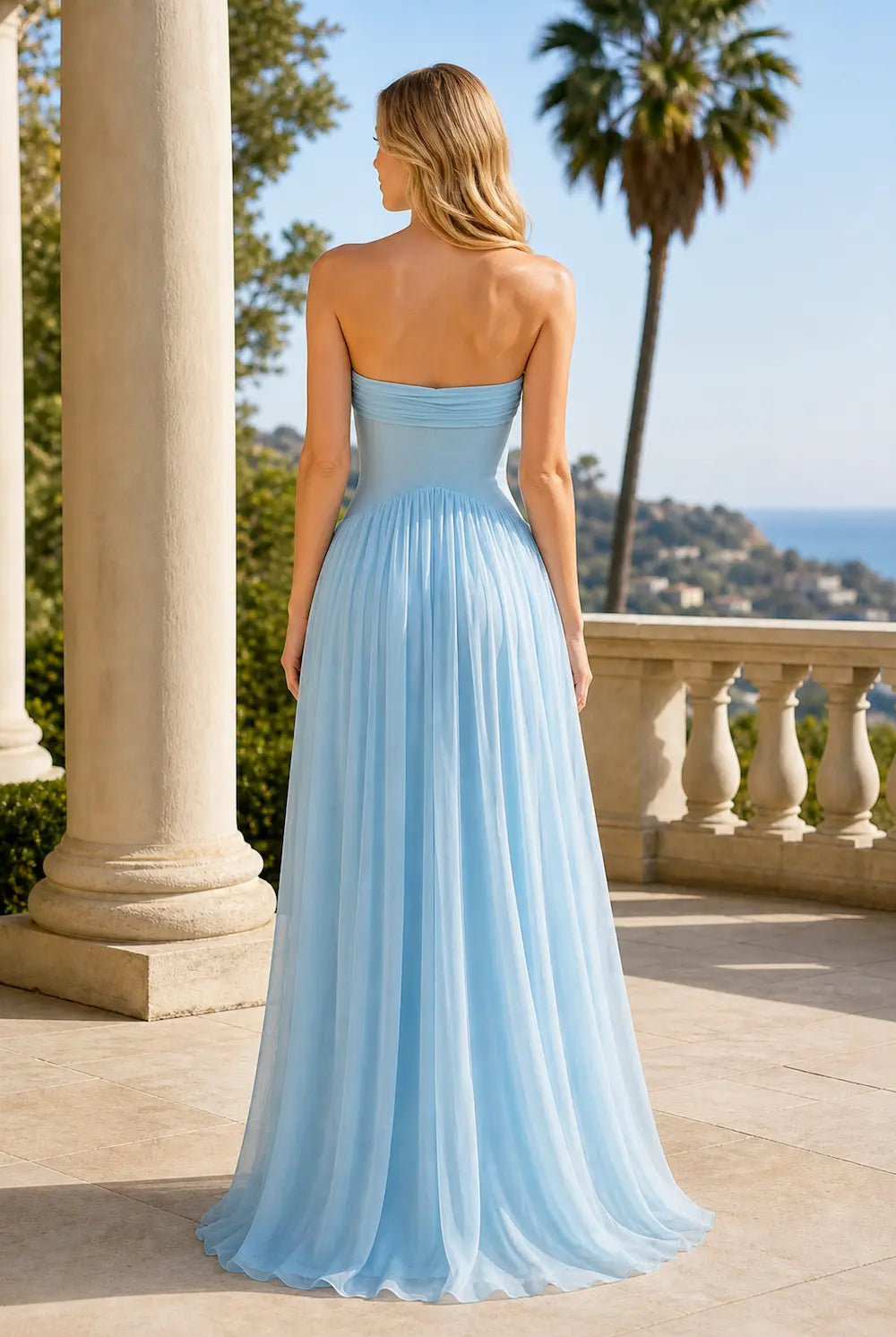 Sky blue strapless maxi dress with back ruching and flowing pleated skirt