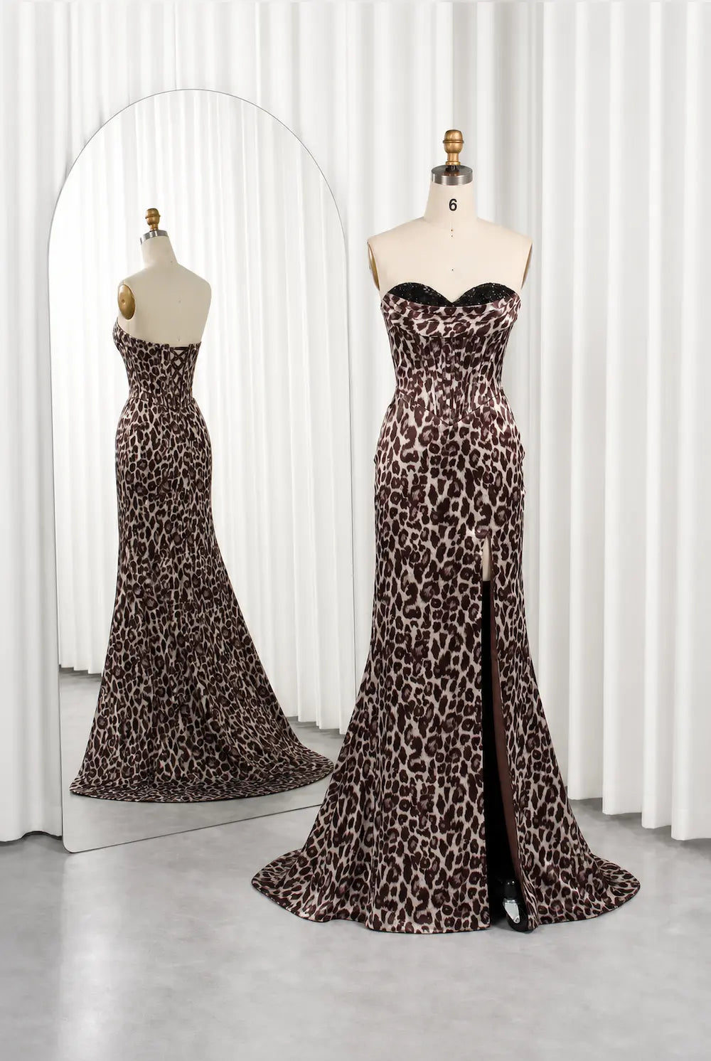 Leopard print maxi dress on mannequins with bustier bodice and flared skirt