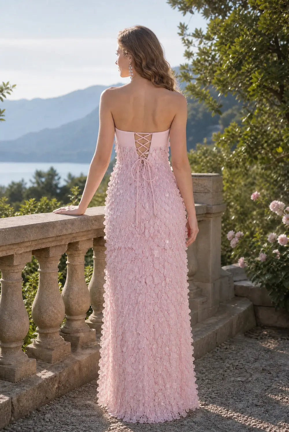 Pink textured maxi dress with open back and lace-up crisscross straps