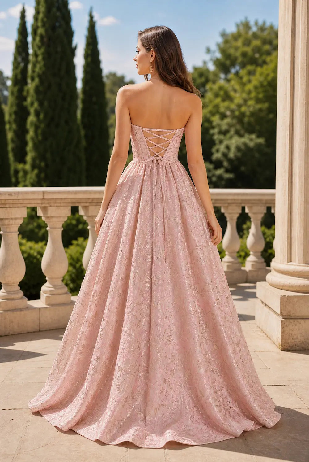 Pink corset-back A-line dress with thin straps and full flowing skirt