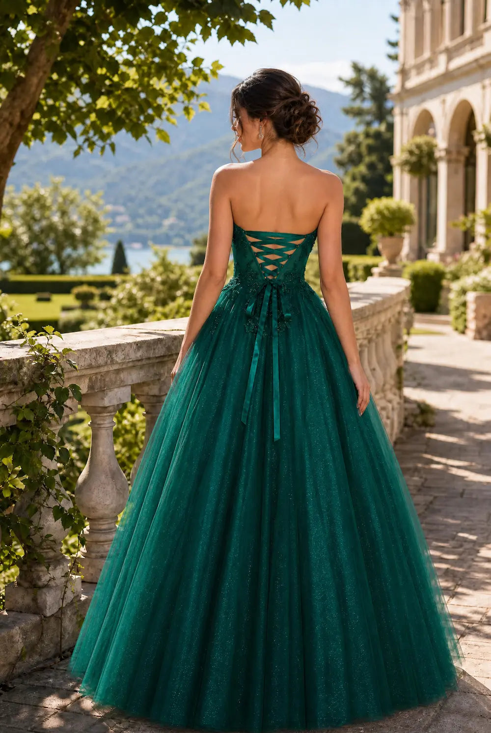 Emerald strapless lace ball gown with open-back corset detail and full tulle skirt