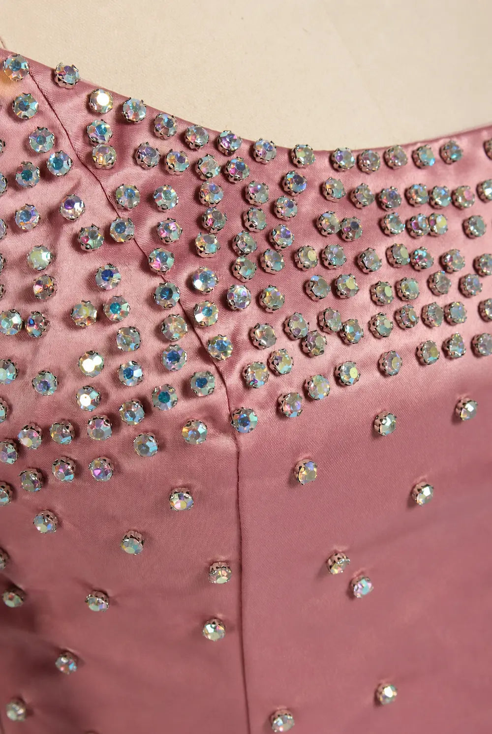 Pink sequin bodice with rhinestone embellishments and buttoned waist panel