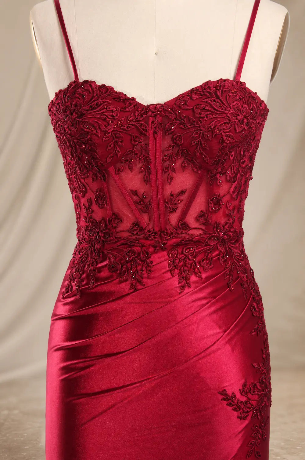 Wine red corset-style bodice dress with embroidered lace details and spaghetti straps