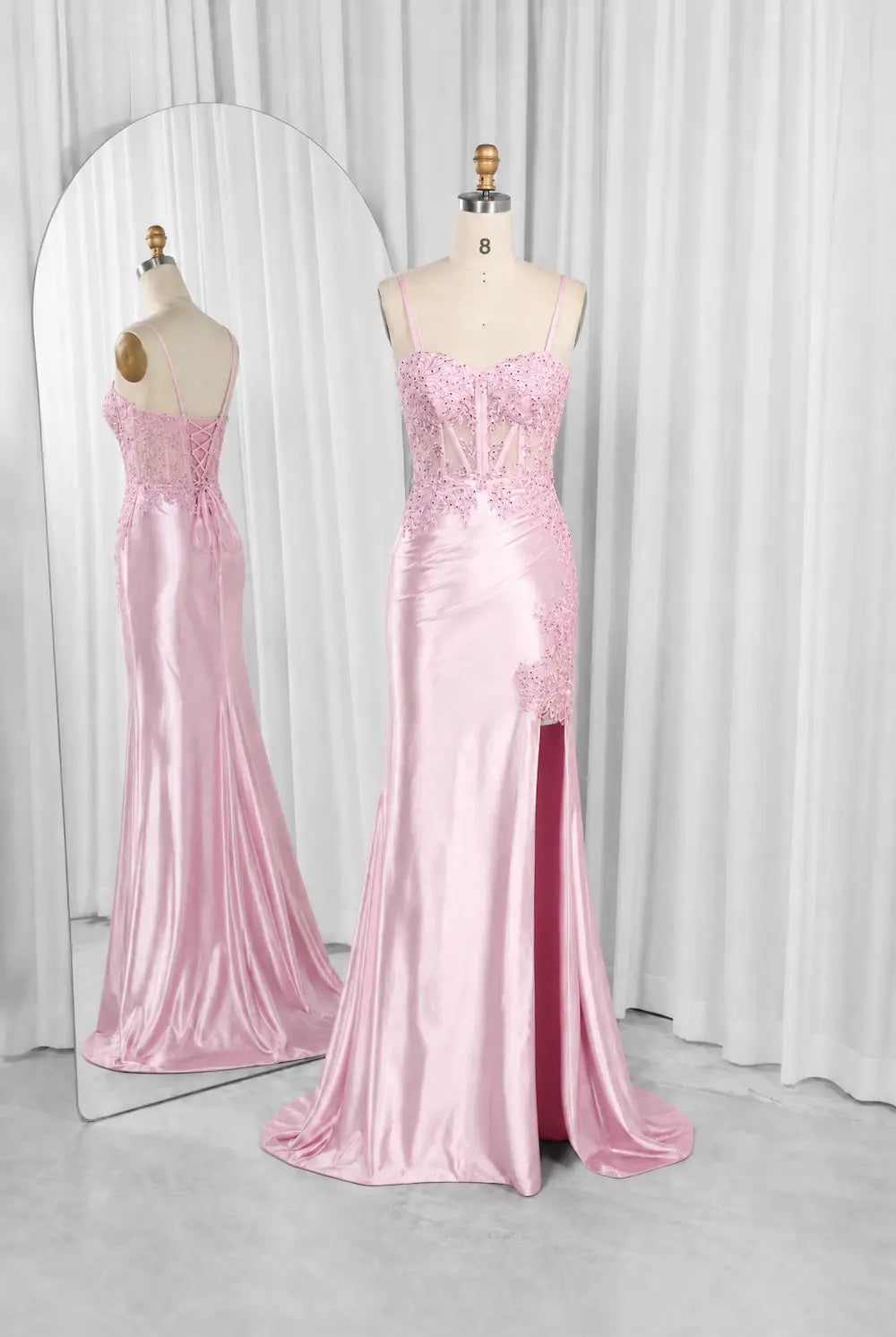Pink embellished evening dress on mannequins, corset bodice, mermaid silhouette