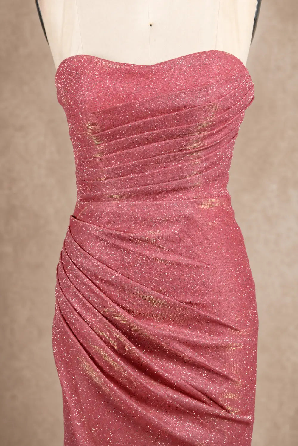 Pink glitter mermaid prom dress bodice close-up, strapless sweetheart, ruched drape