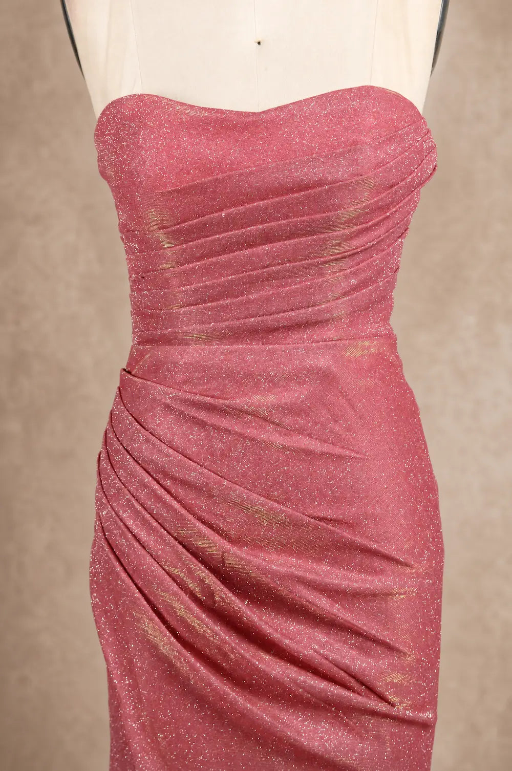 Pink glitter mermaid prom dress bodice close-up, strapless sweetheart, ruched drape