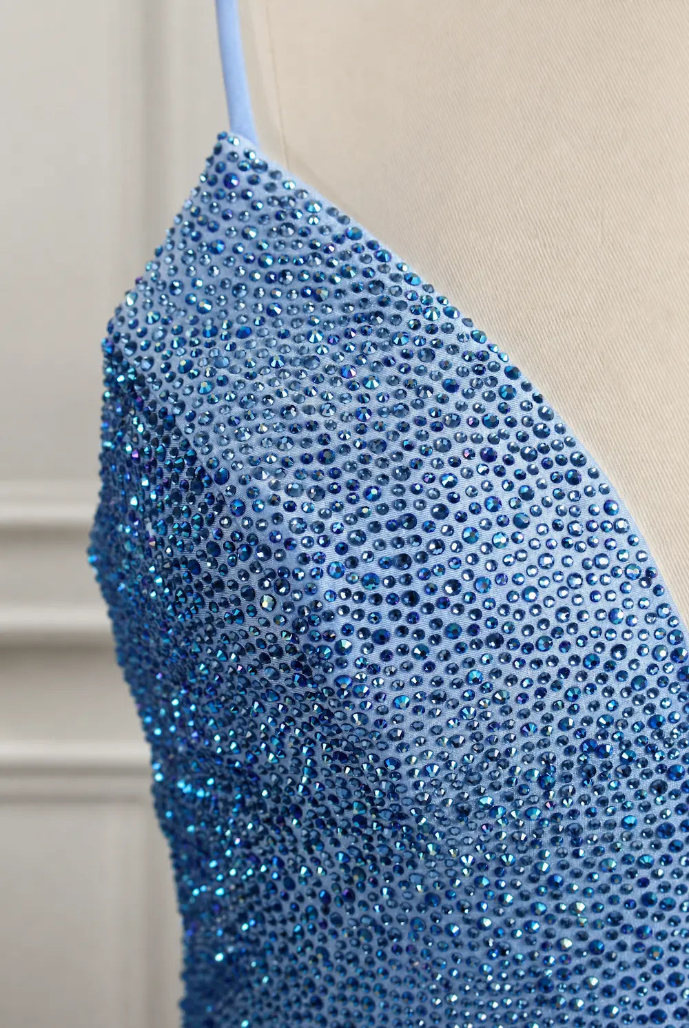 Blue rhinestone V-neck mermaid prom dress bodice with dense sparkling detail