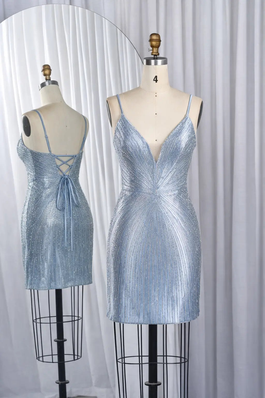 Light blue sequin mini dress on mannequins, V-neck front and open back lace-up straps