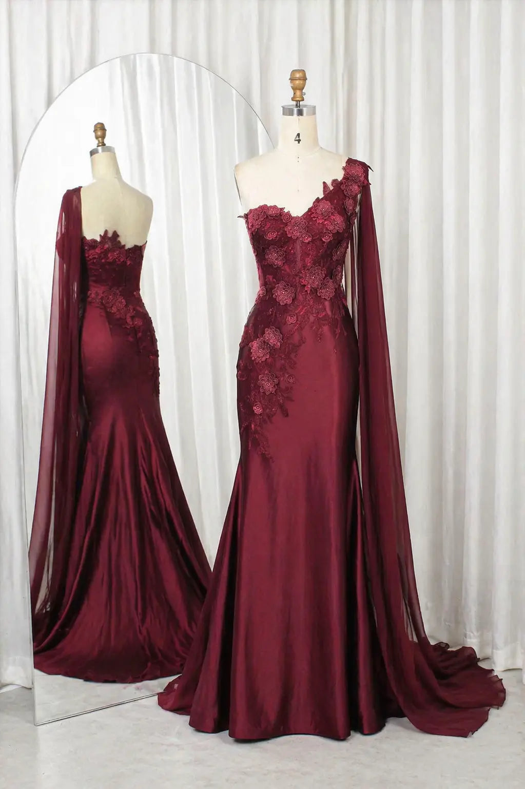 Wine one-shoulder satin gown with 3D floral appliqués and draped sleeves