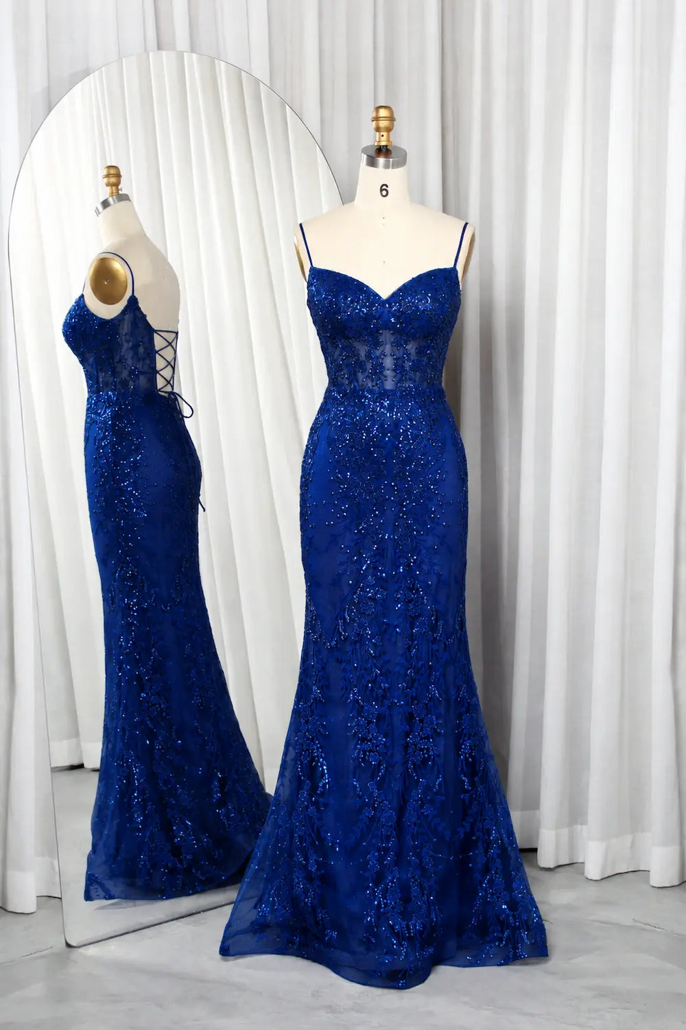 Royal blue mermaid corset prom dress with lace texture and thin straps