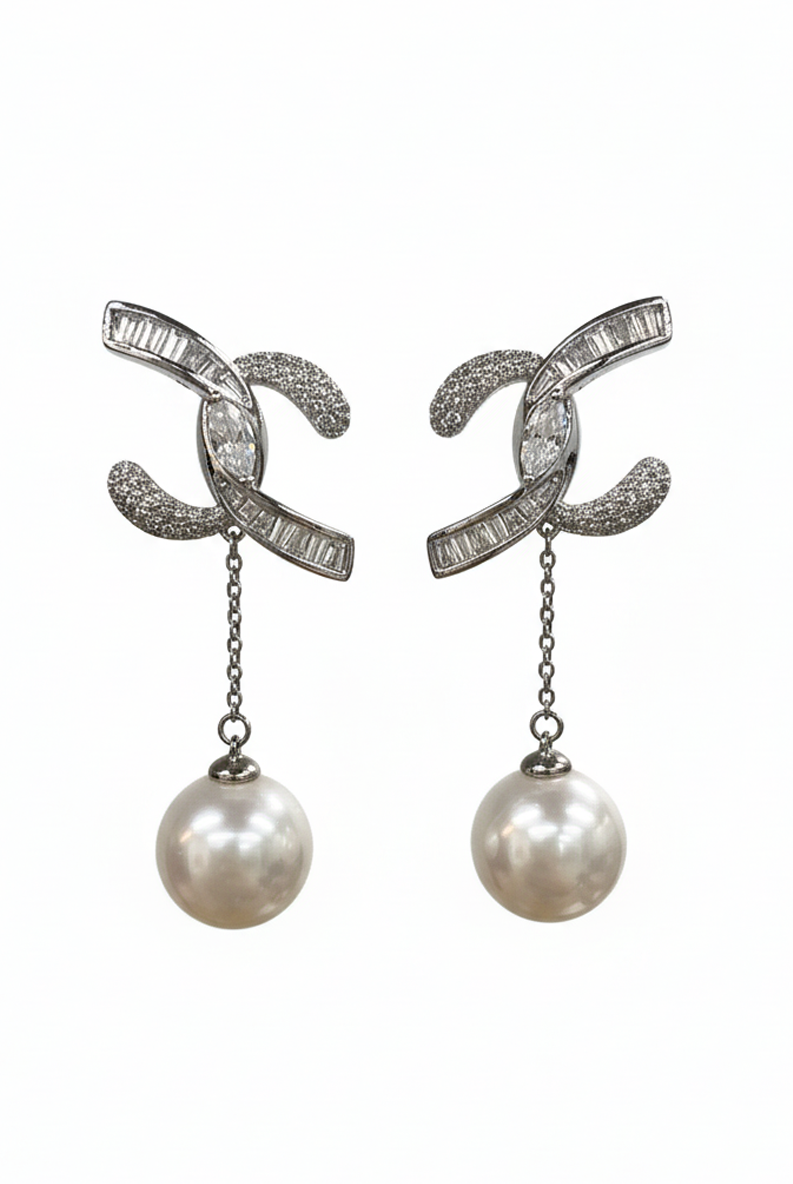 Crystal and pearl drop earrings with interlocking geometric hoops and dangling pearl