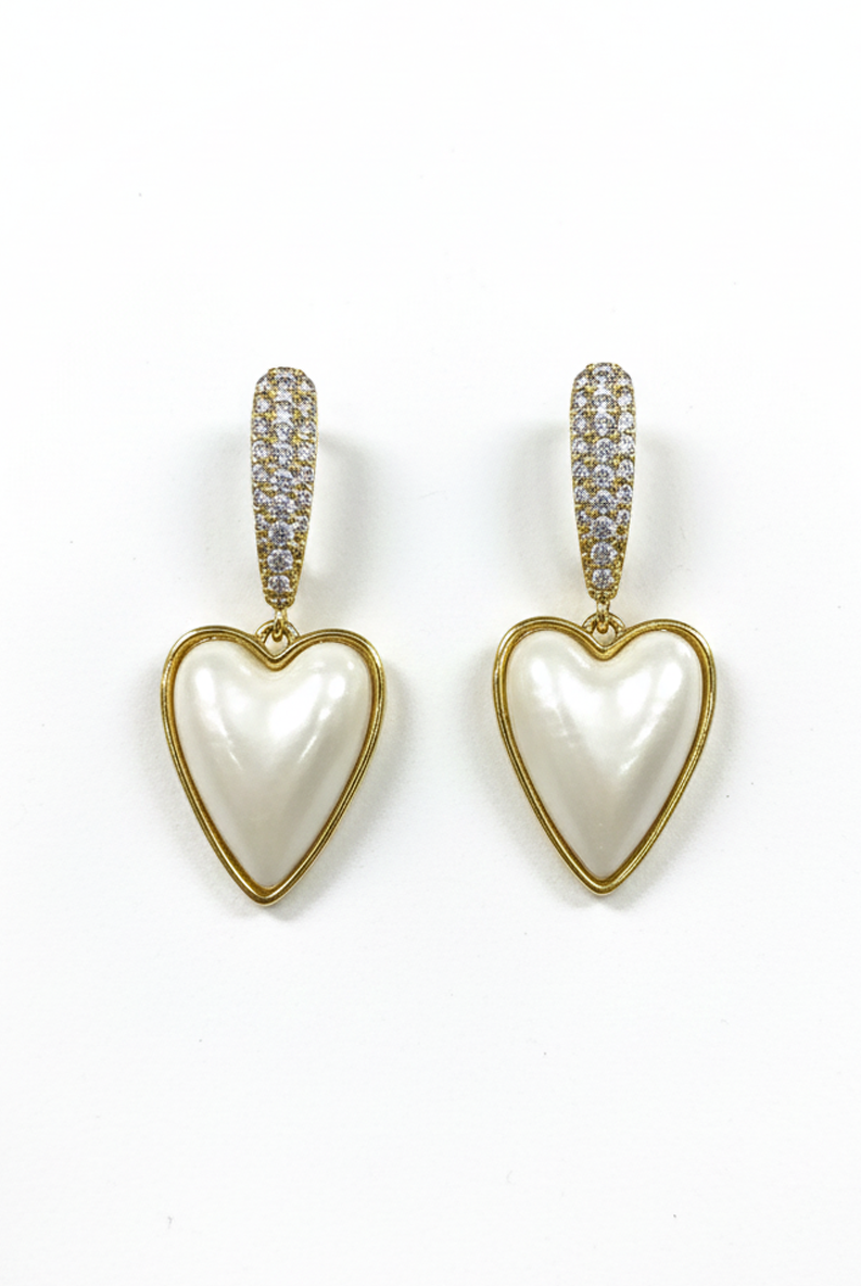 Heart-shaped pearl drop earrings with gold huggie tops, glittered accents