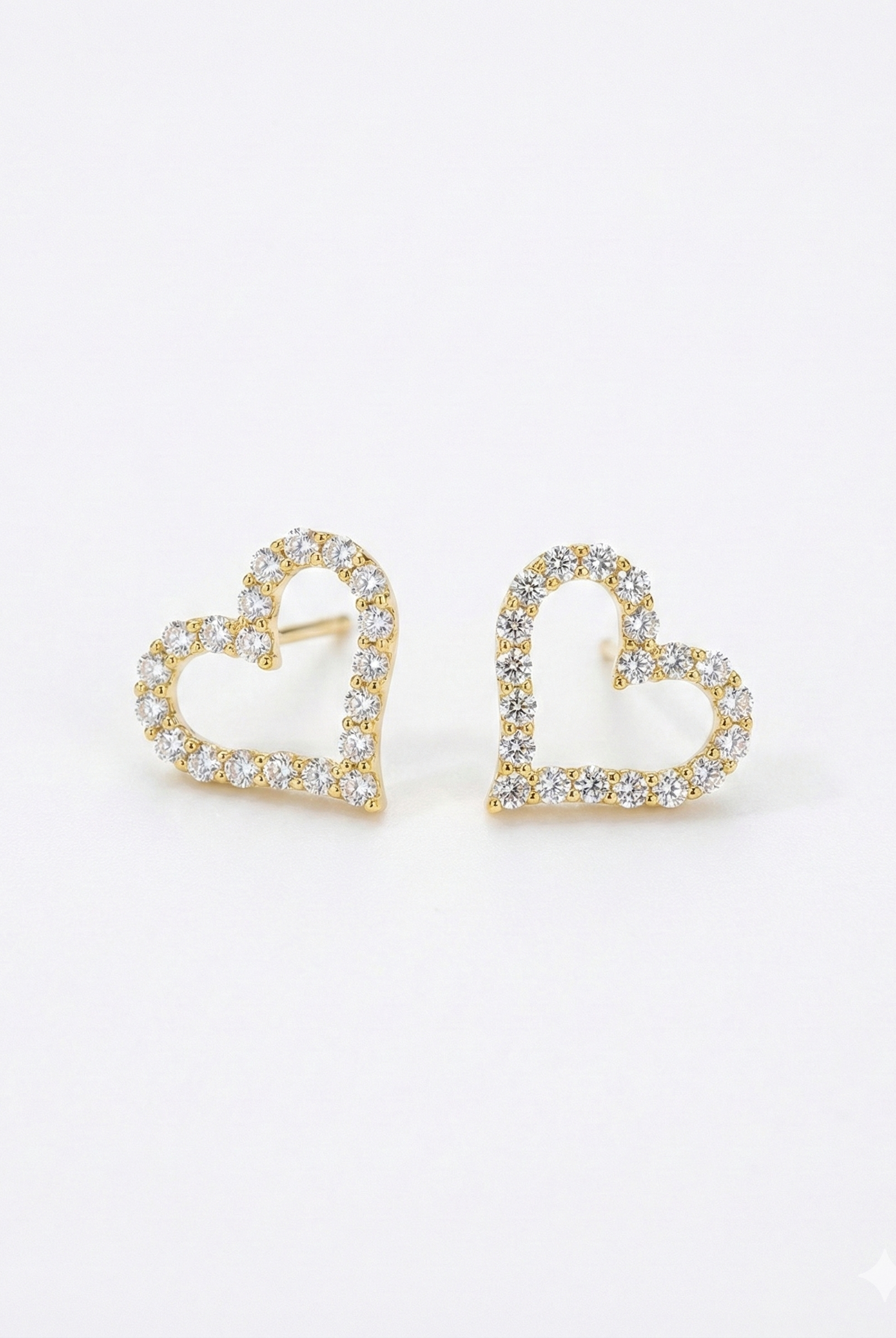 Gold-tone open heart stud earrings with pavé crystal detail, heart-shaped fronts
