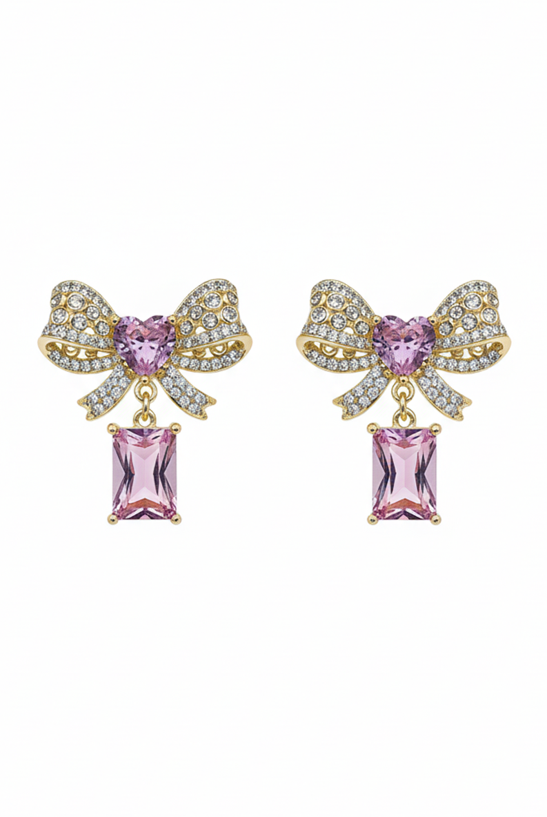 Gold-tone bow knot earrings with faceted pink stone drop and crystal sparkle