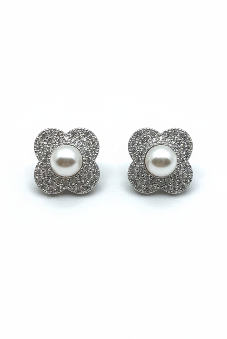 Floral stud earrings with glittery silver petals and a white pearl center