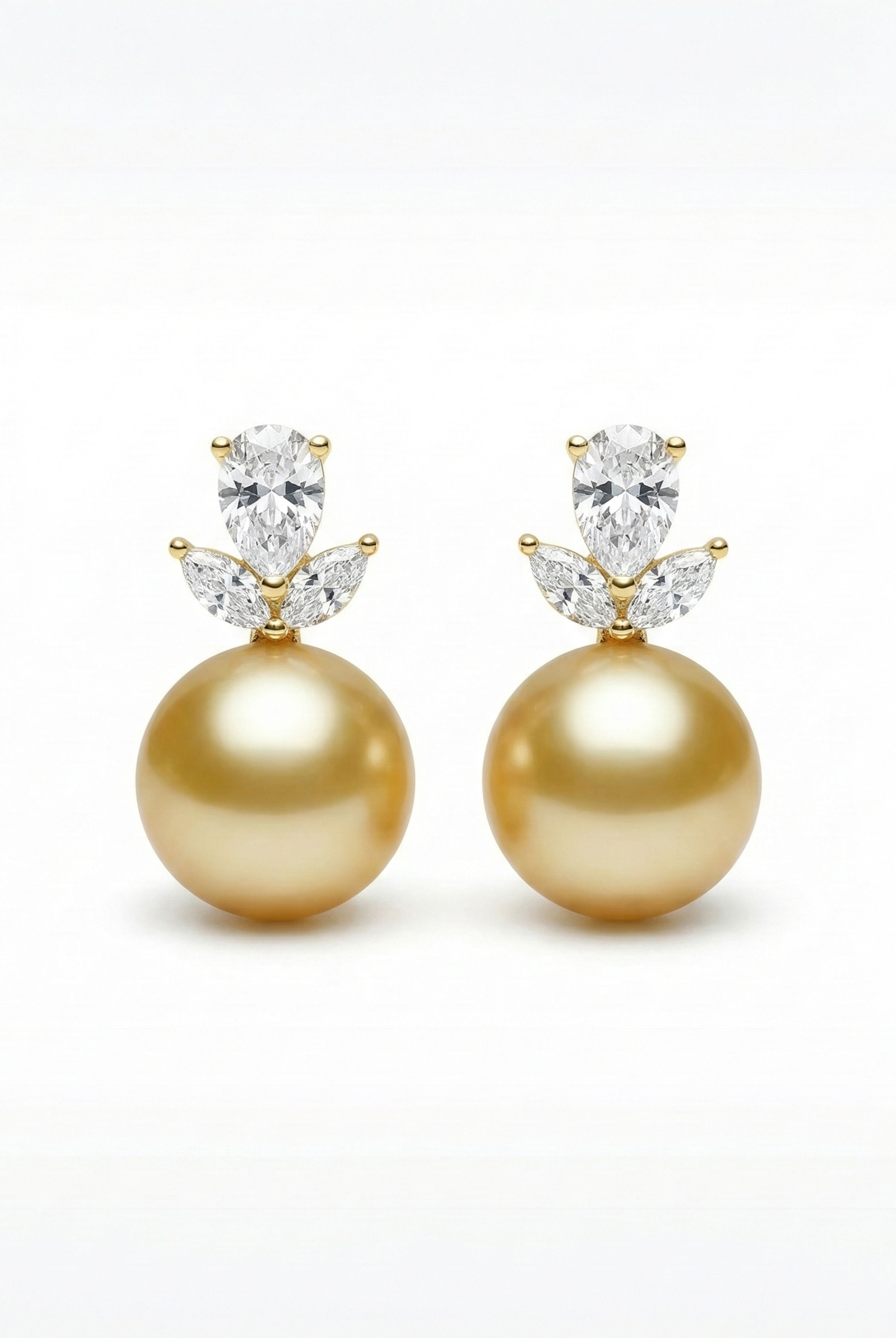 Gold-tone drop earrings with large golden pearl and clear marquise crystal tops
