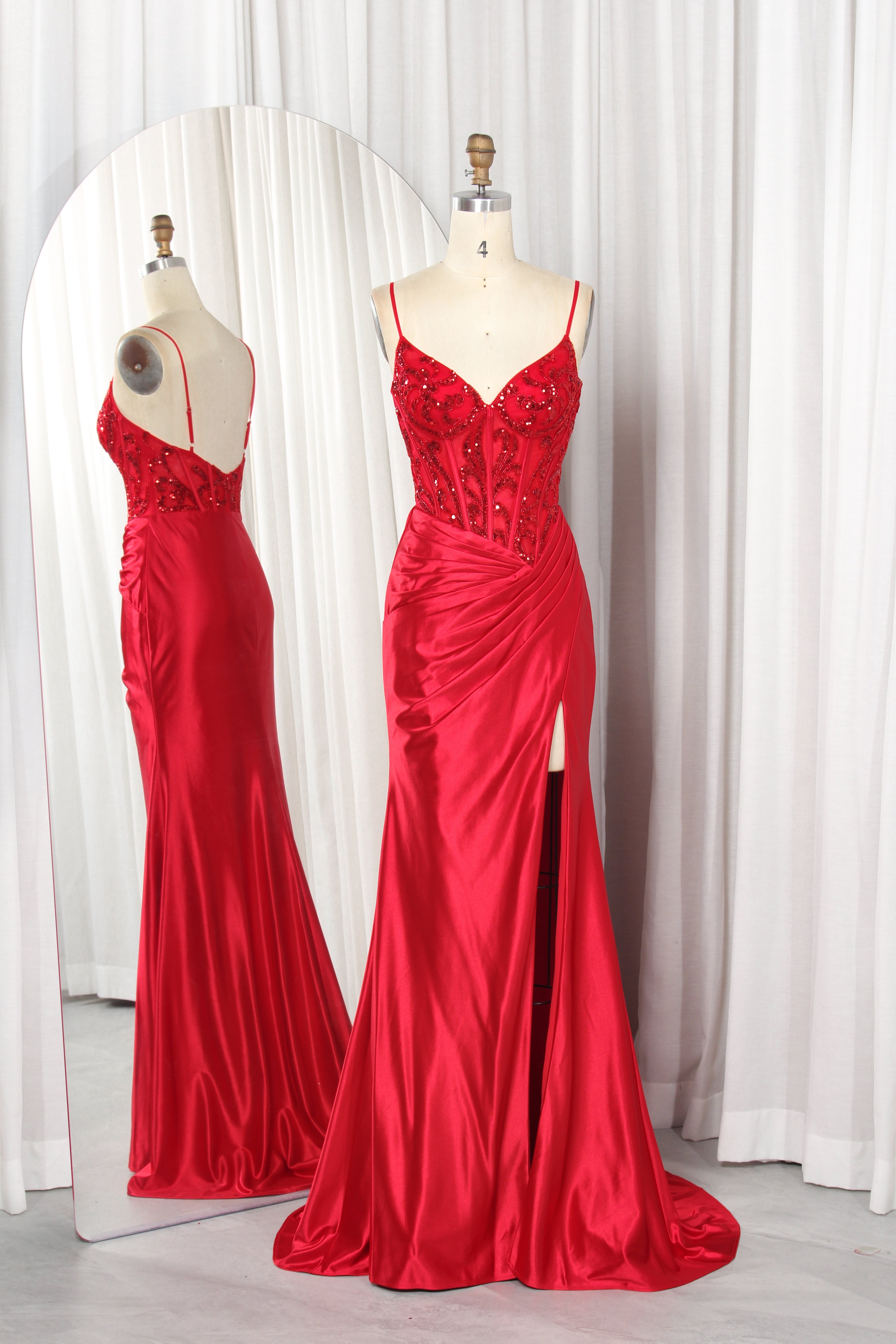 Red satin mermaid gown with beaded corset bodice and front slit, two views
