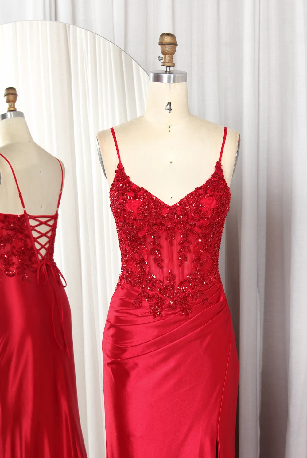 Red sequin fitted gown with spaghetti straps and V-neck