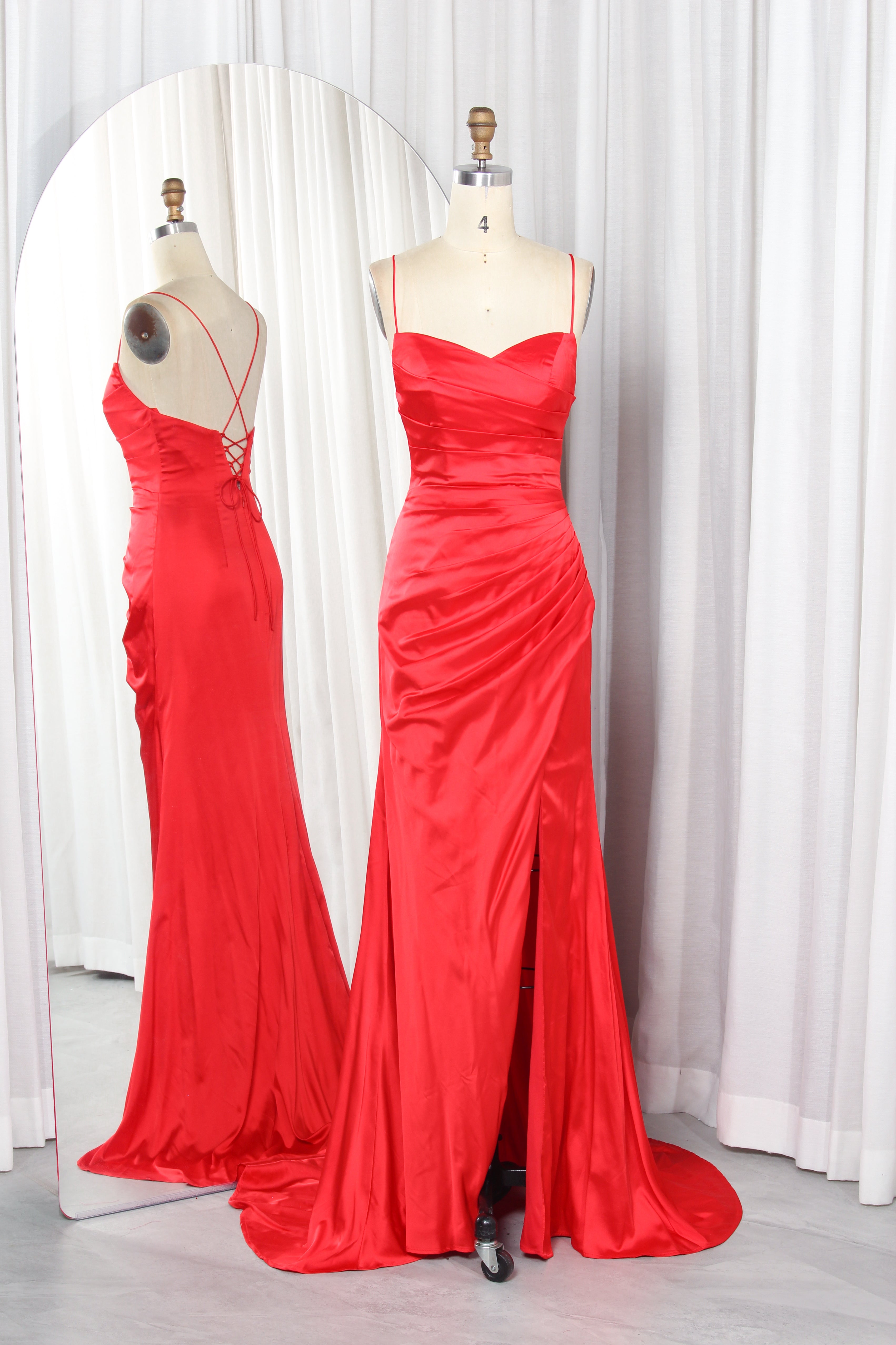 Red satin ruched sweetheart gown with thin straps and front slit