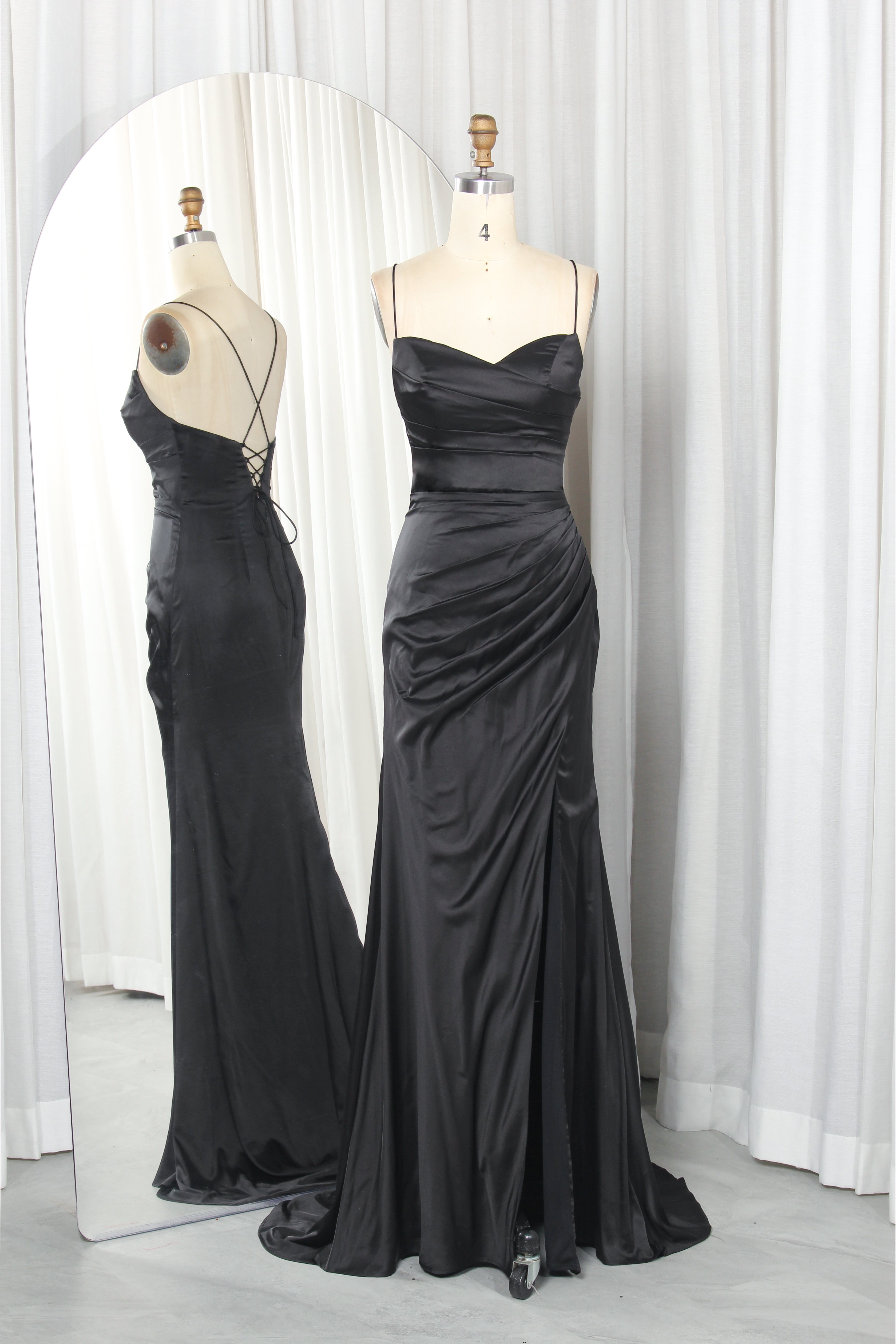 Black satin gown with crisscross lace-up back, sweetheart neckline, and slit
