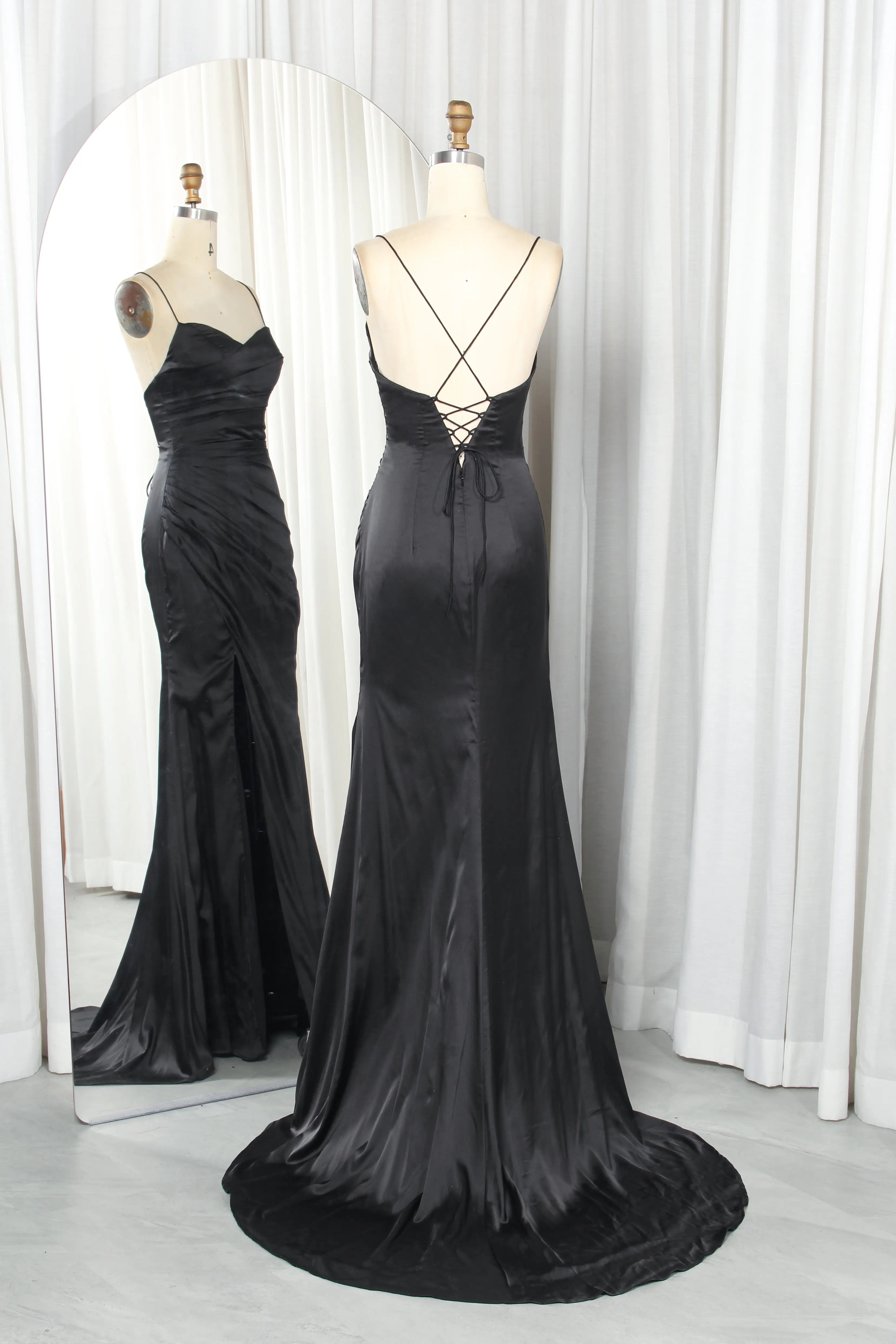 Black satin gown with crisscross lace-up back and flowing front slit