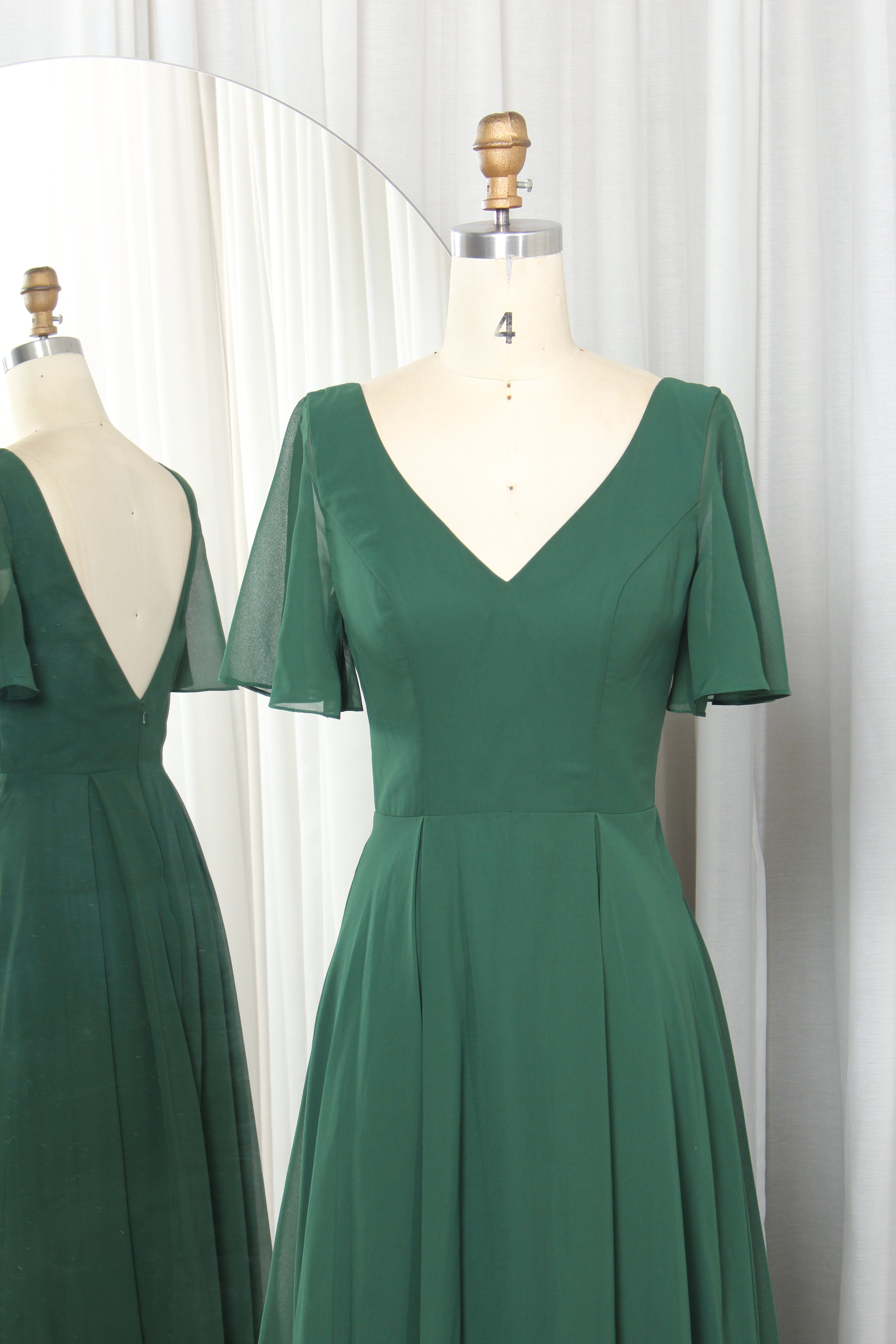 V-neck chiffon dress with flutter sleeves and a V-back.