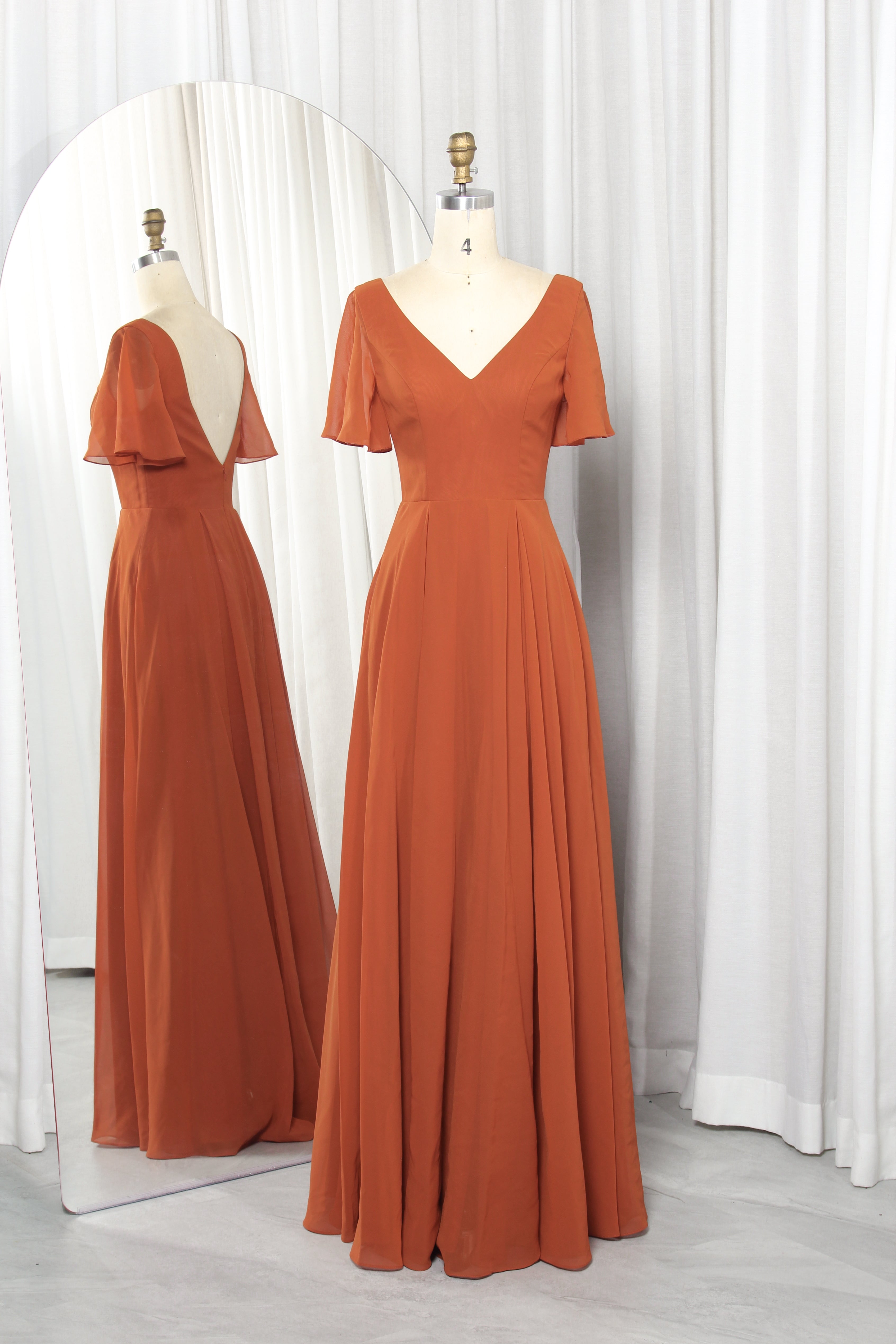 V-neck chiffon dress with flutter sleeves and a V-back.