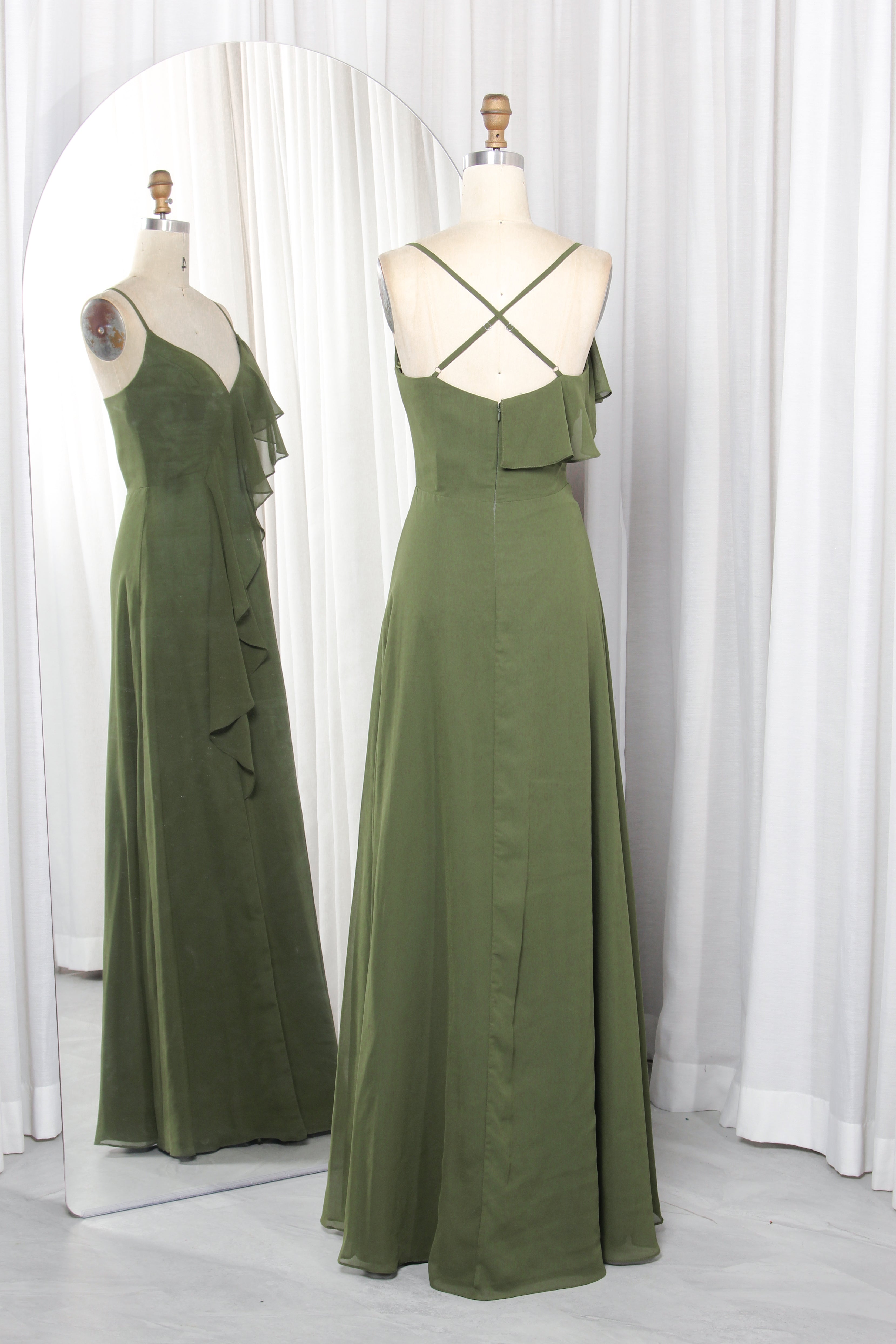 Olive green chiffon bridesmaid dress with spaghetti straps, V-neckline, and cascading ruffles on a mannequin