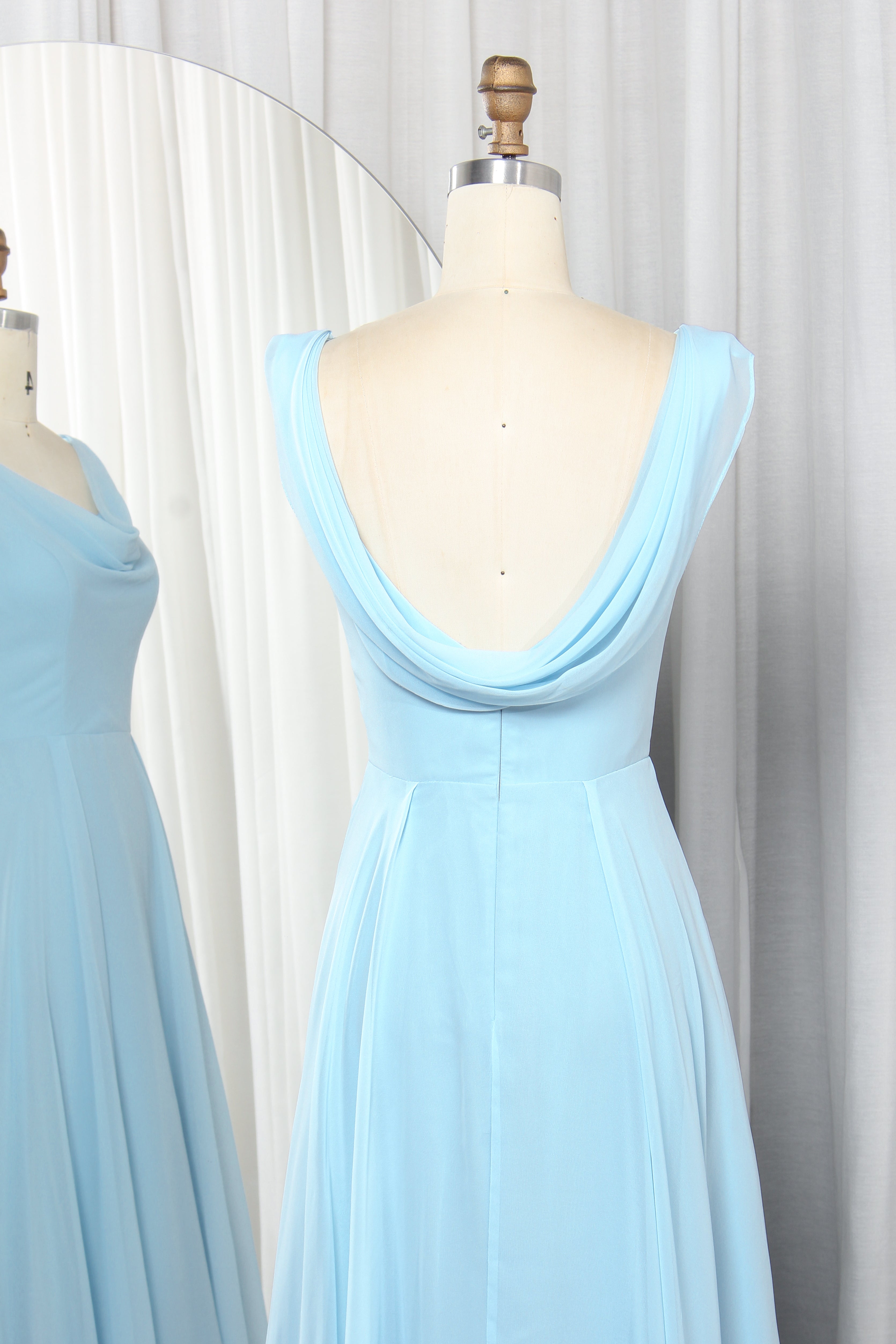 cowl neck chiffon dress with a draped back.