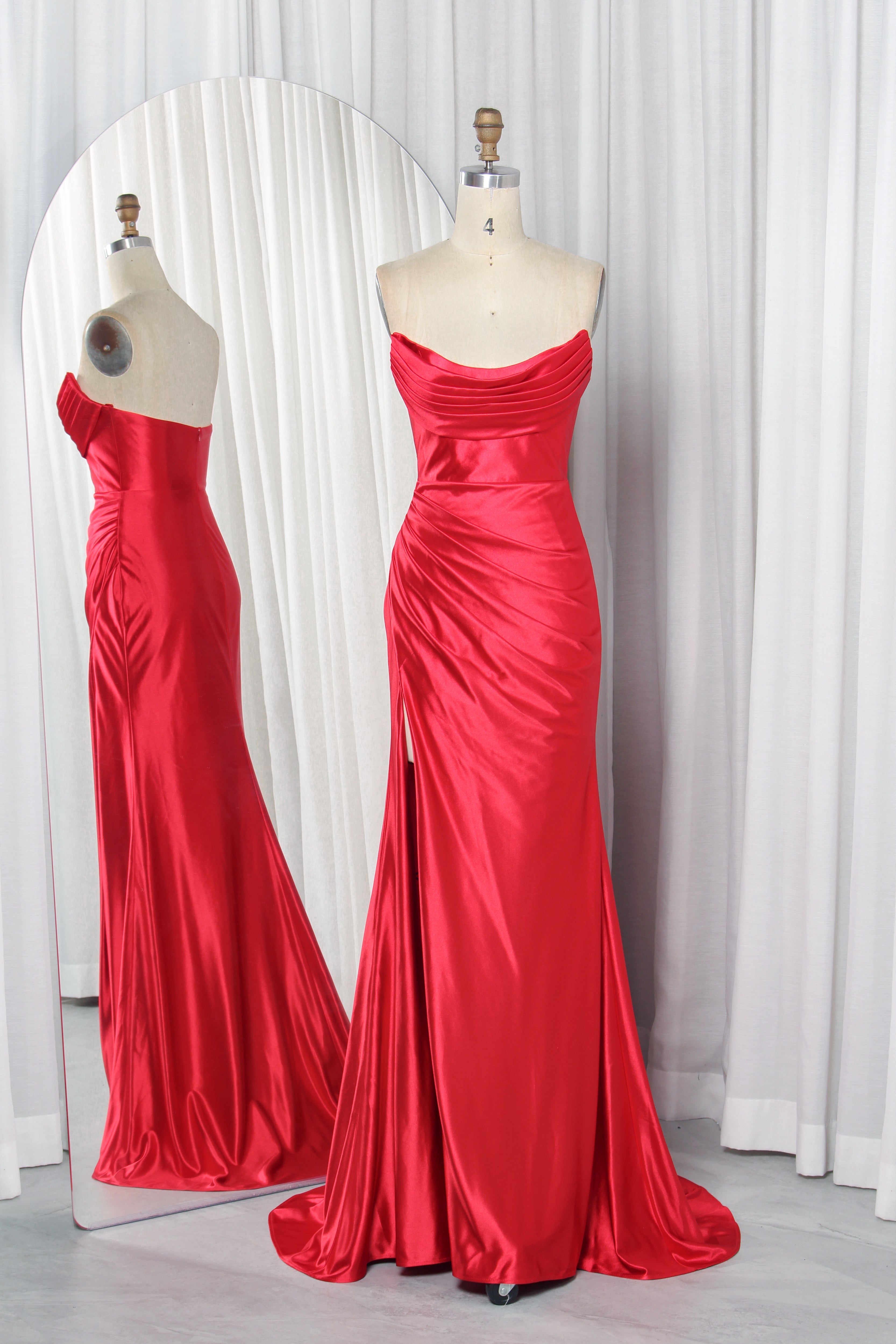 Red strapless draped satin mermaid prom gown with fitted waist and long flared skirt